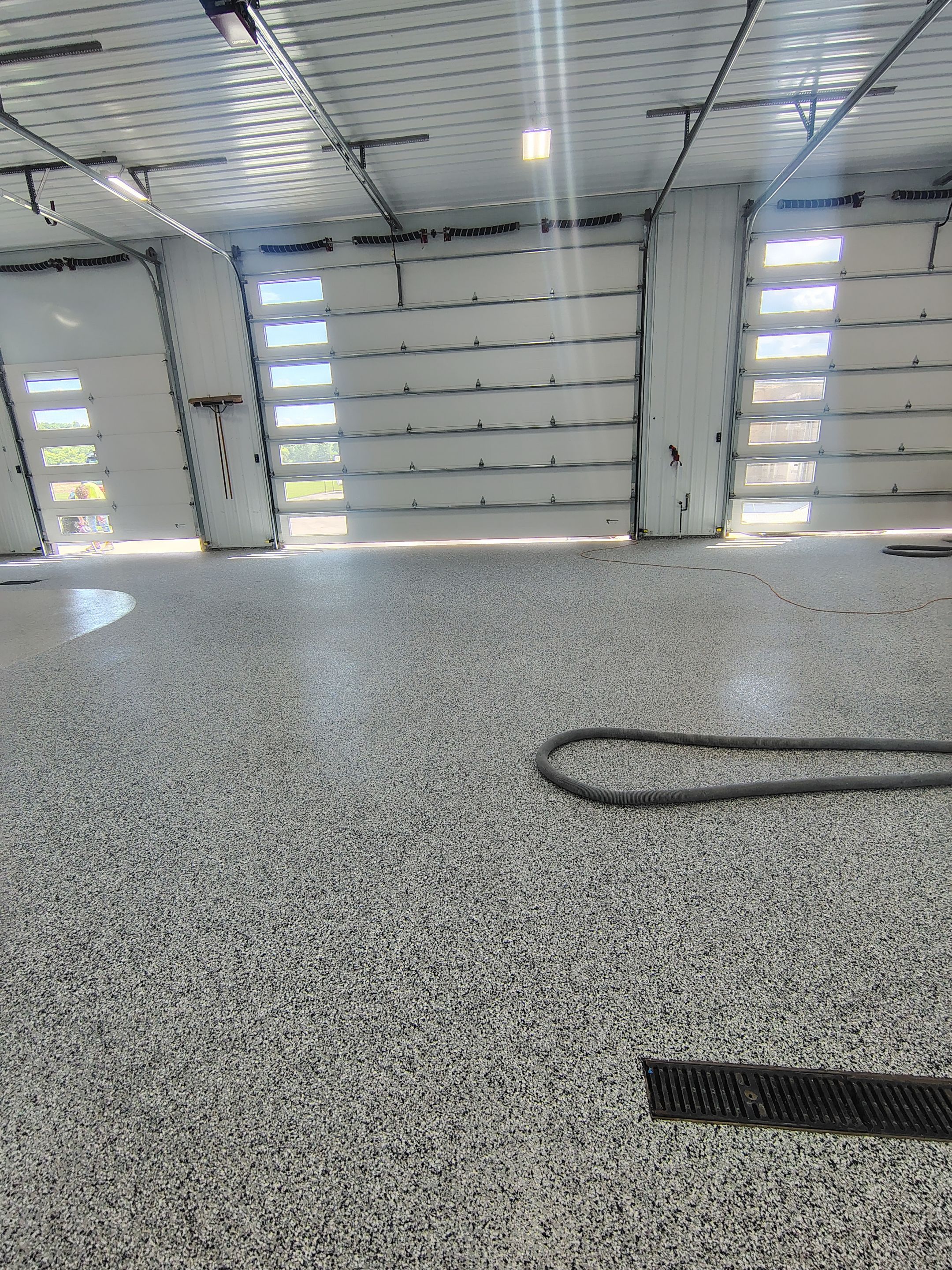 Multi-Stage Concrete Floor Coating for Egan Shop and RV Storage by Select Painting, Coatings & Garage Cabinets