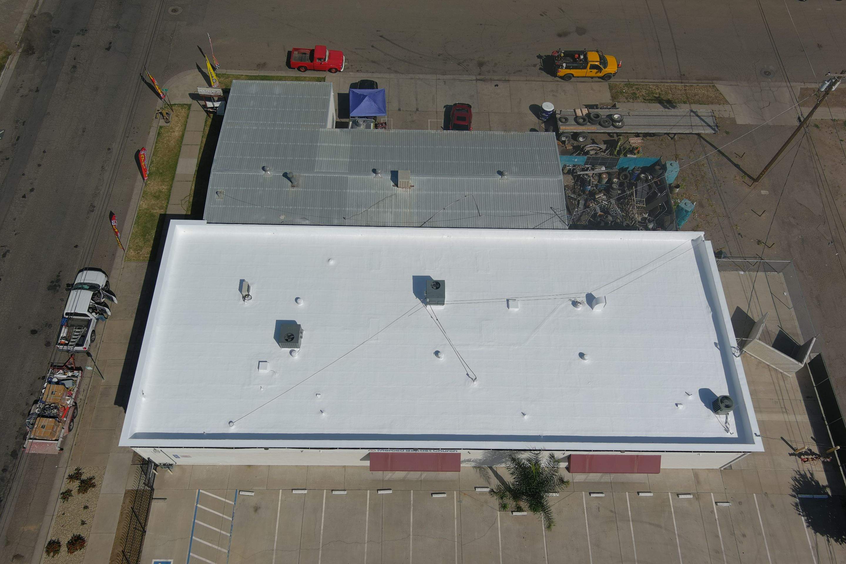 Spray foam and coatings using Conklin Benchmark/PUMA XL coatings and spray foam by Straight Edge Roofing Inc