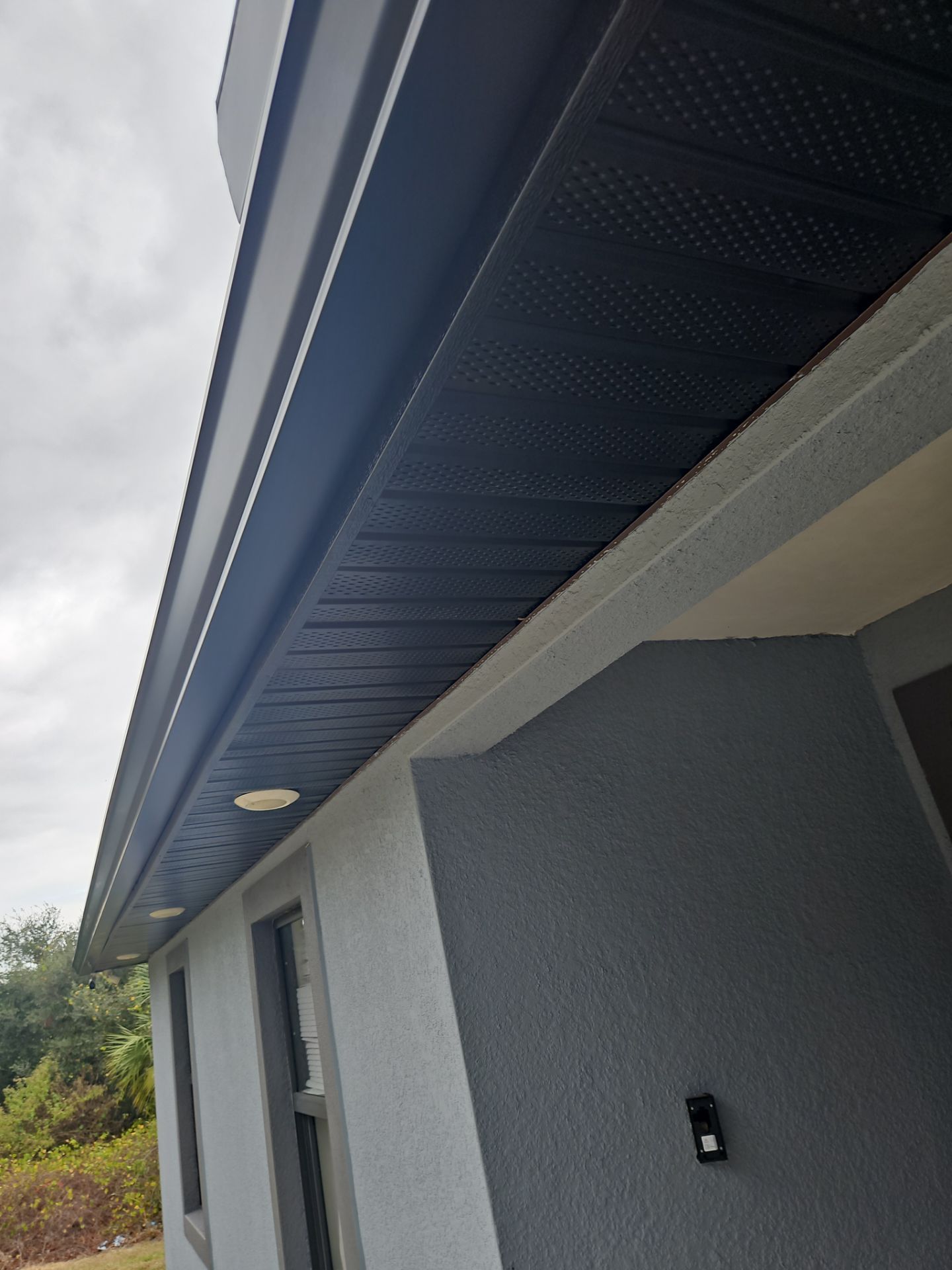Black Seamless Gutters & Soffit/Fascia in Lehigh Acres FL by Gutter Professors