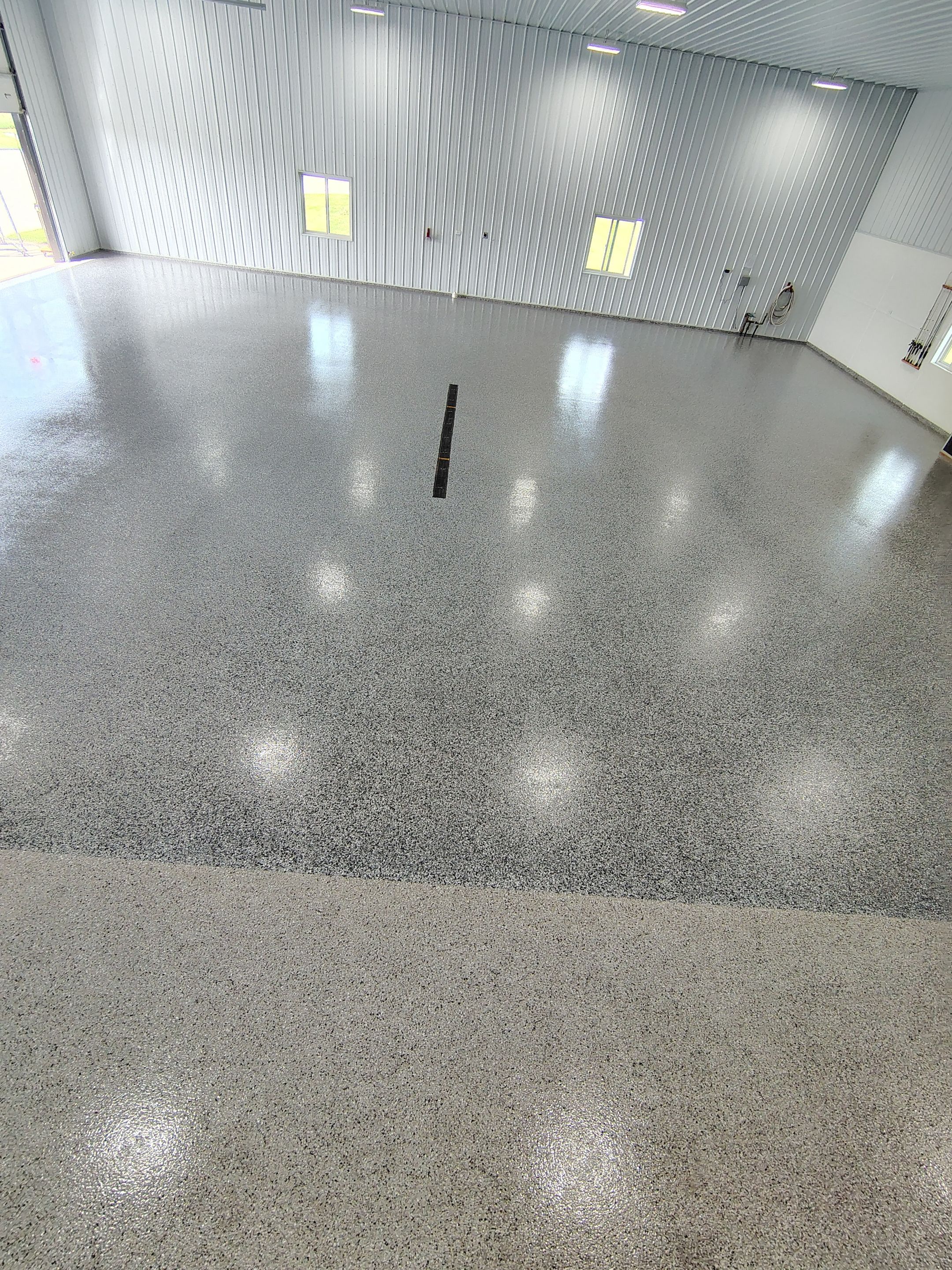 Multi-Stage Concrete Floor Coating for Egan Shop and RV Storage by Select Painting, Coatings & Garage Cabinets