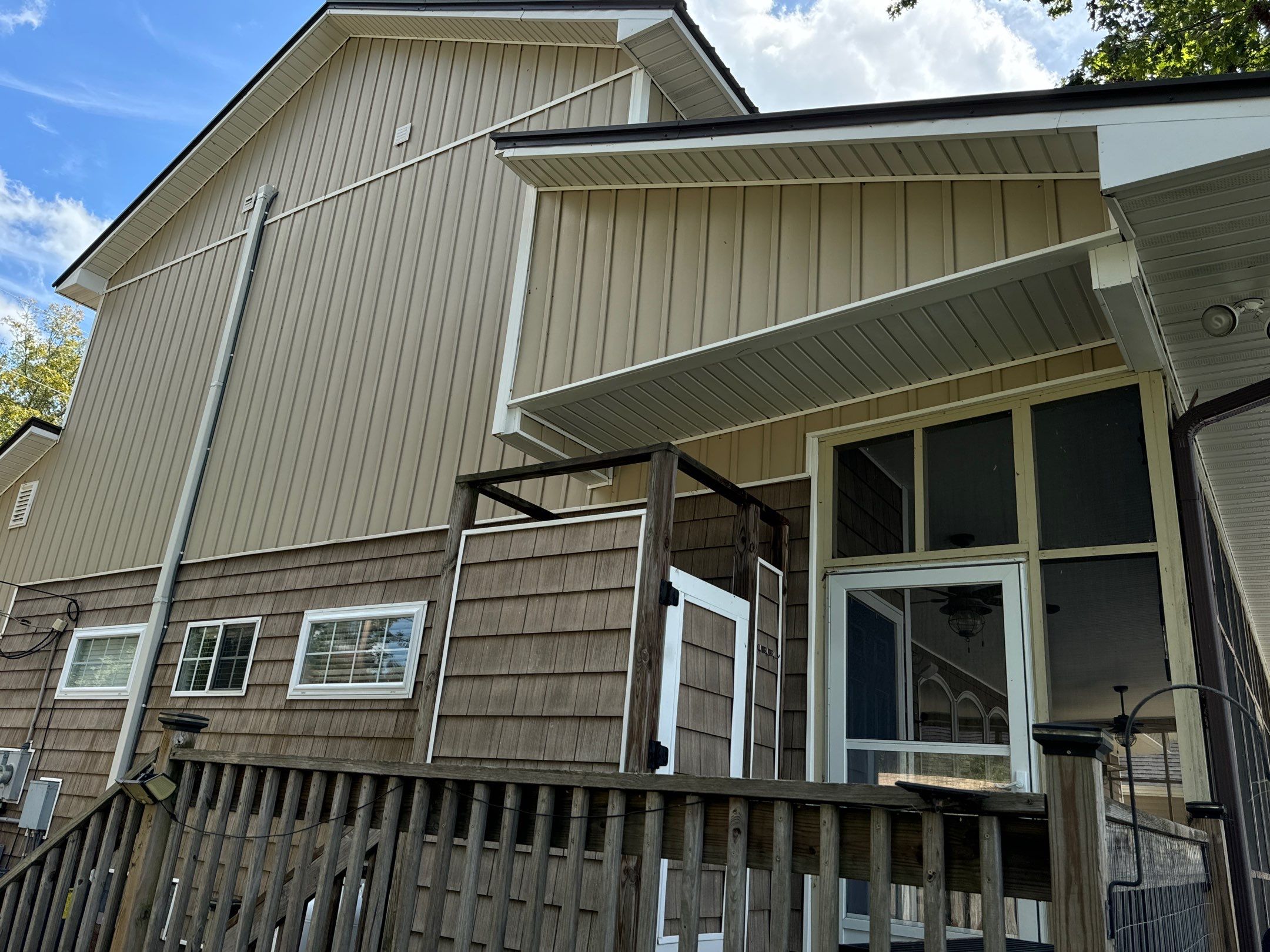 the service being done is cleaning the siding and porch area of the house using a pressure washer technique