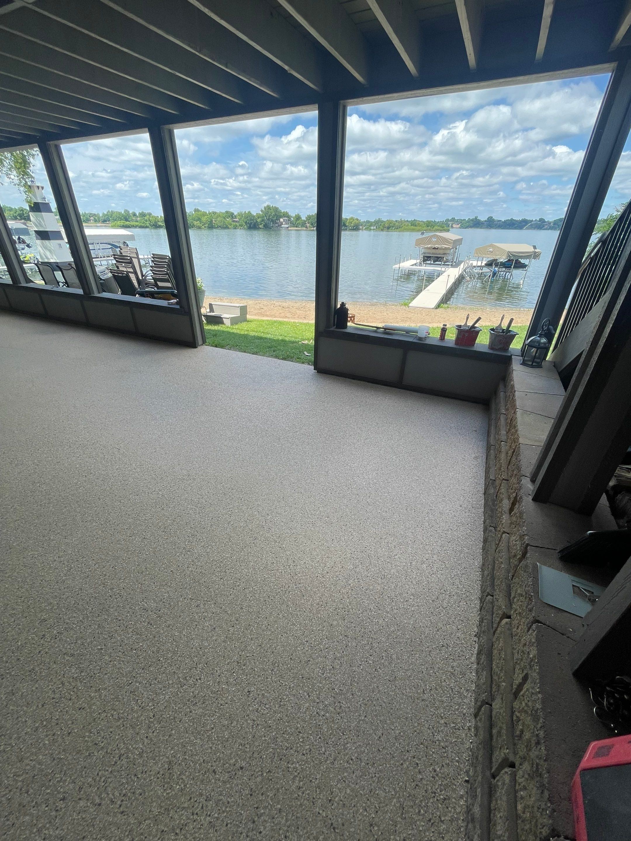 Lakefront Screened Patio Concrete Coating Installation in Wentworth by Select Painting, Coatings & Garage Cabinets