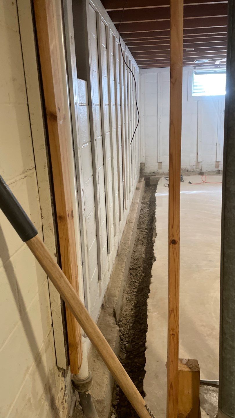 Interior Drain Tile & Buried Discharge in St. Anthony, MN by Waterproofing Northeast