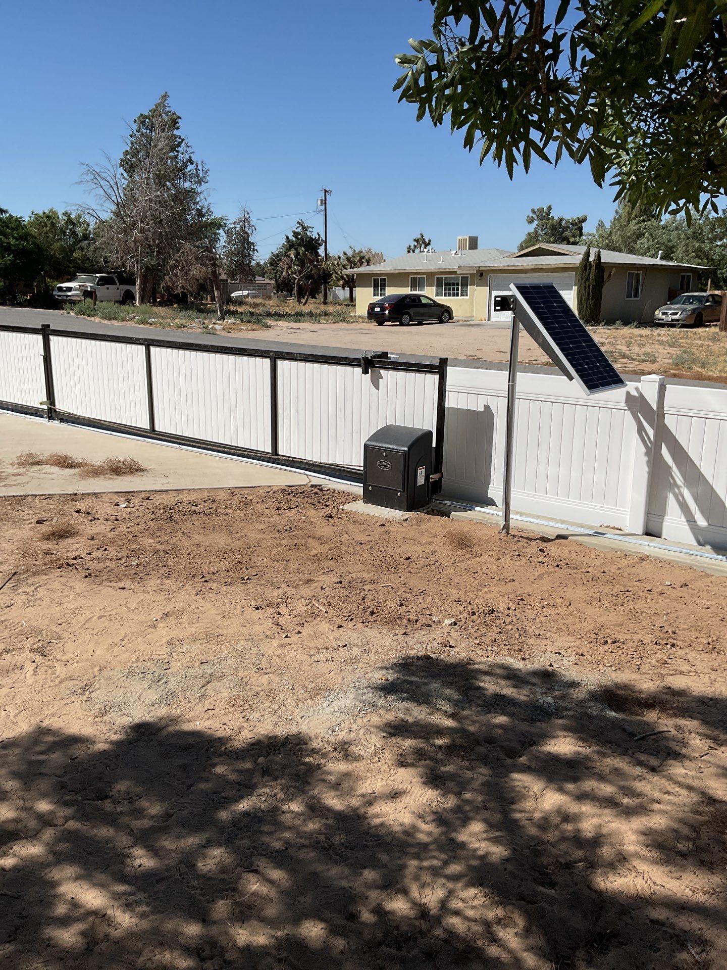 4ft White Vinyl Fence with Solar Power Motorized Gate by Fence Guys Inc.