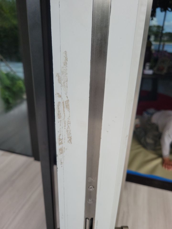 Custom Material Pivot Door installation by Impact Precious Wood Inc.