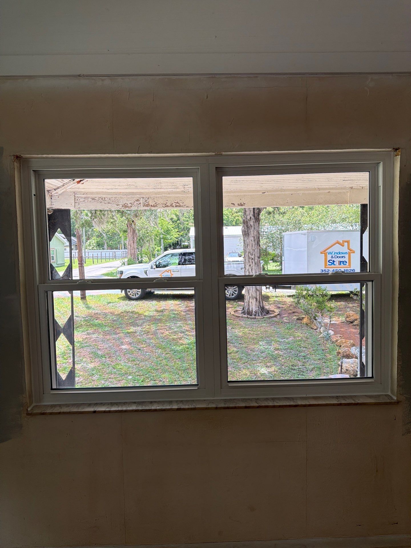 White Vinyl Window Replacement for Residential Home in Williston by Windows & Doors Store