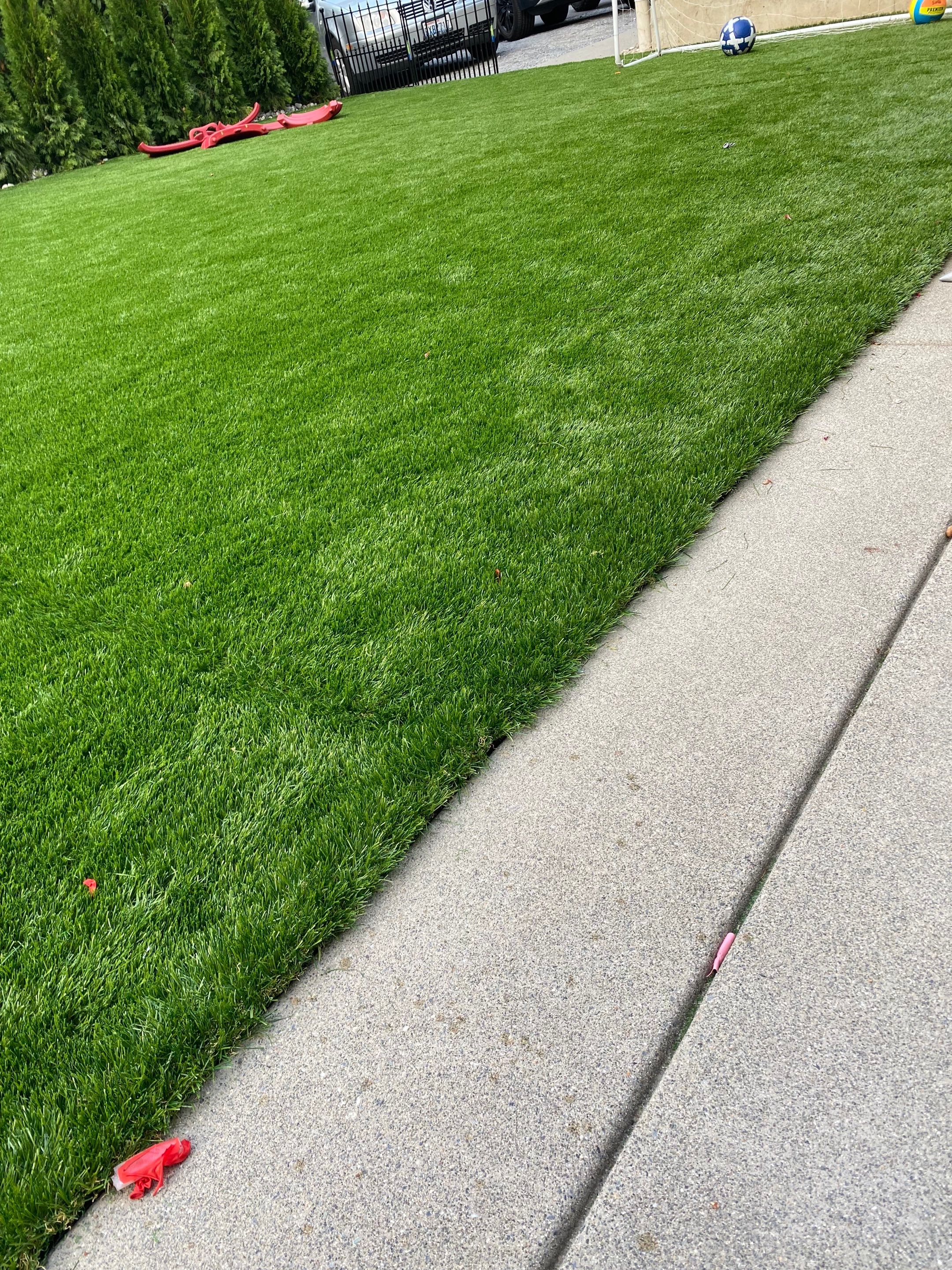 Patio Installation using Concrete, Retaining walls, and Turf install by Jireh Asphalt & Concrete Inc 