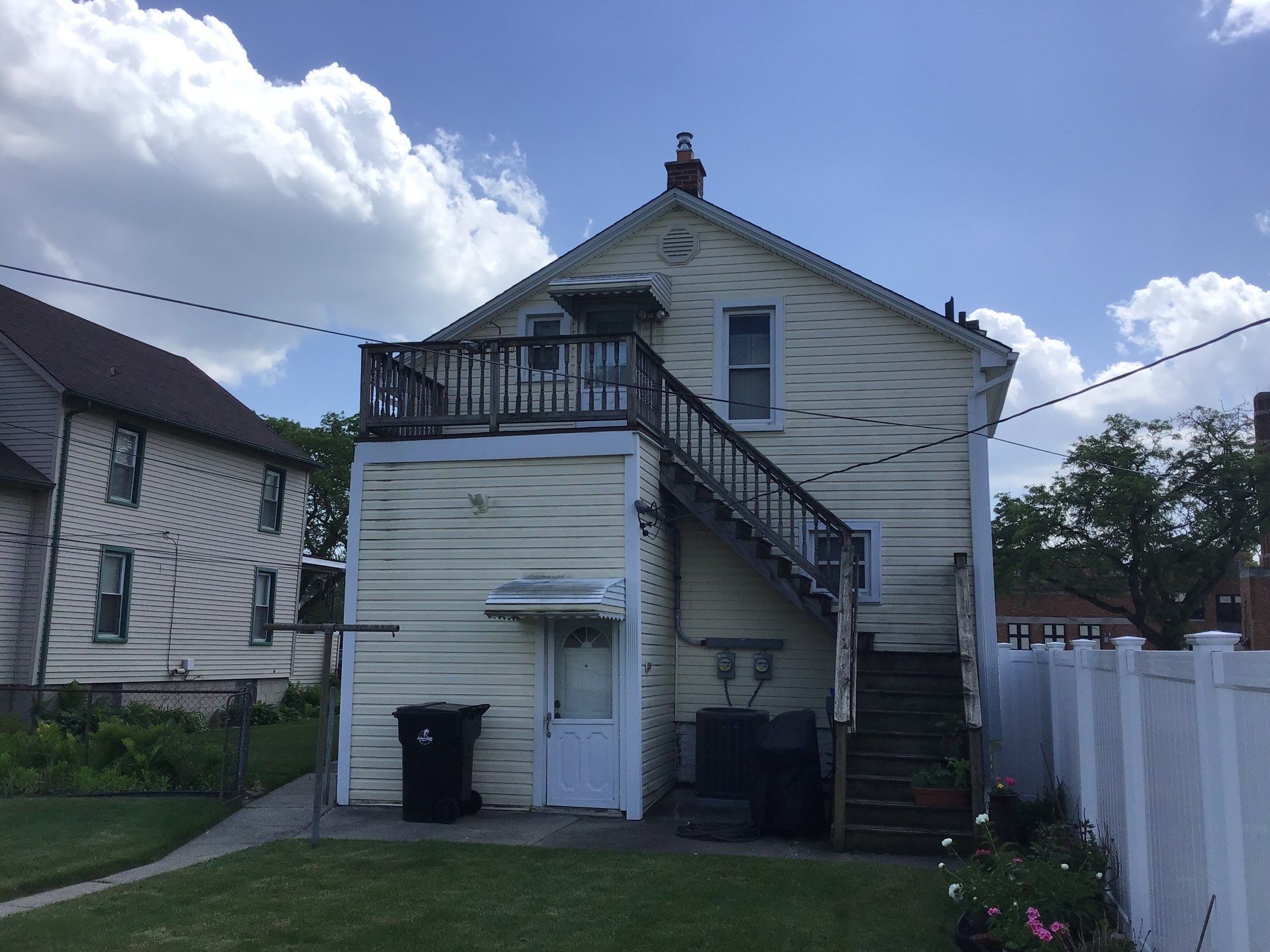 Rebuild balcony flat roofing TREX decking stairway and Railings in Wyandotte, MI by Northwest Construction 