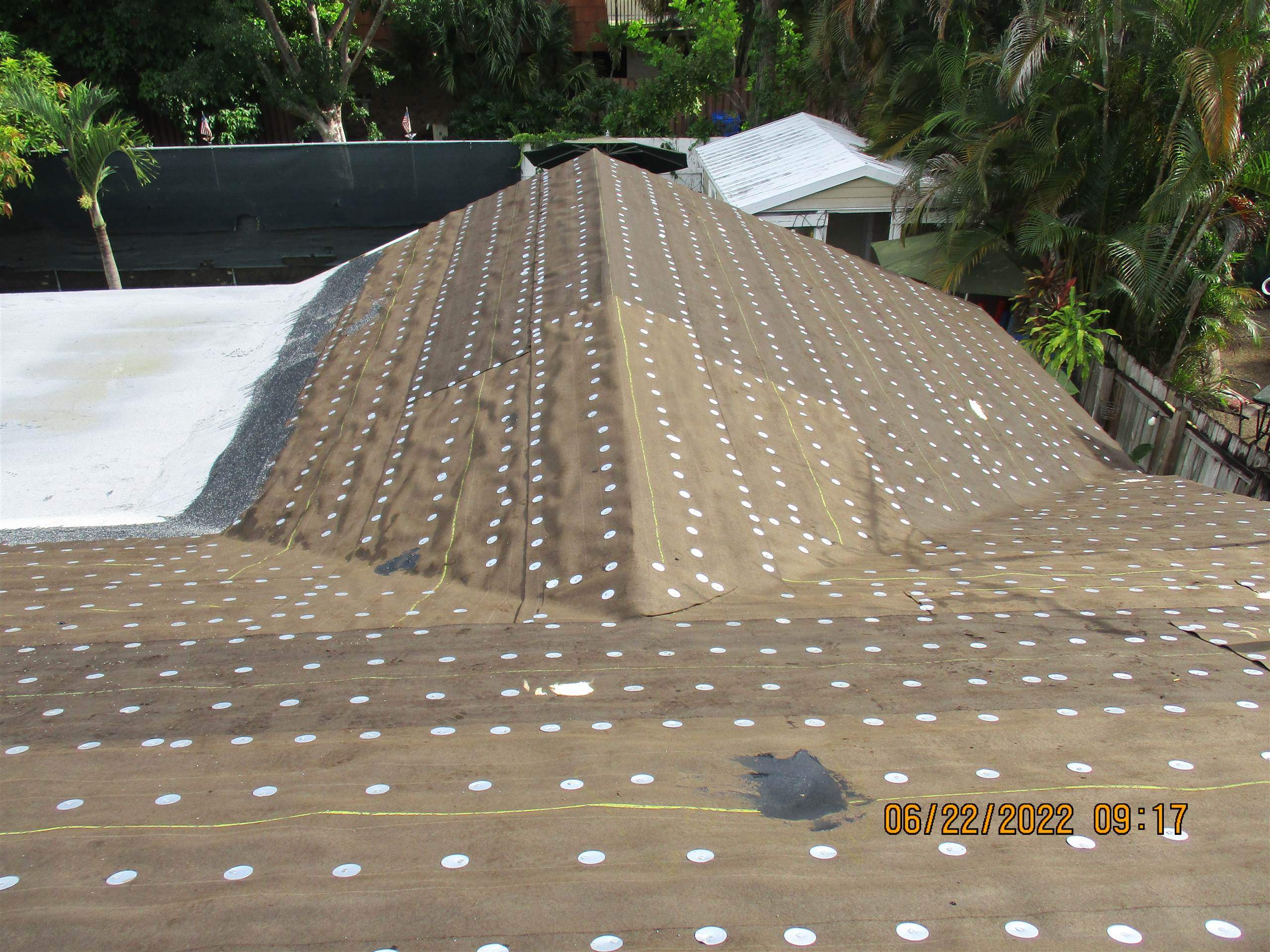 Residential Roofing Installation using 1.5" Nail Strip 24ga Solar White Kynar Coated Standing Seam Metal Panels by Morton Roofing, Inc.