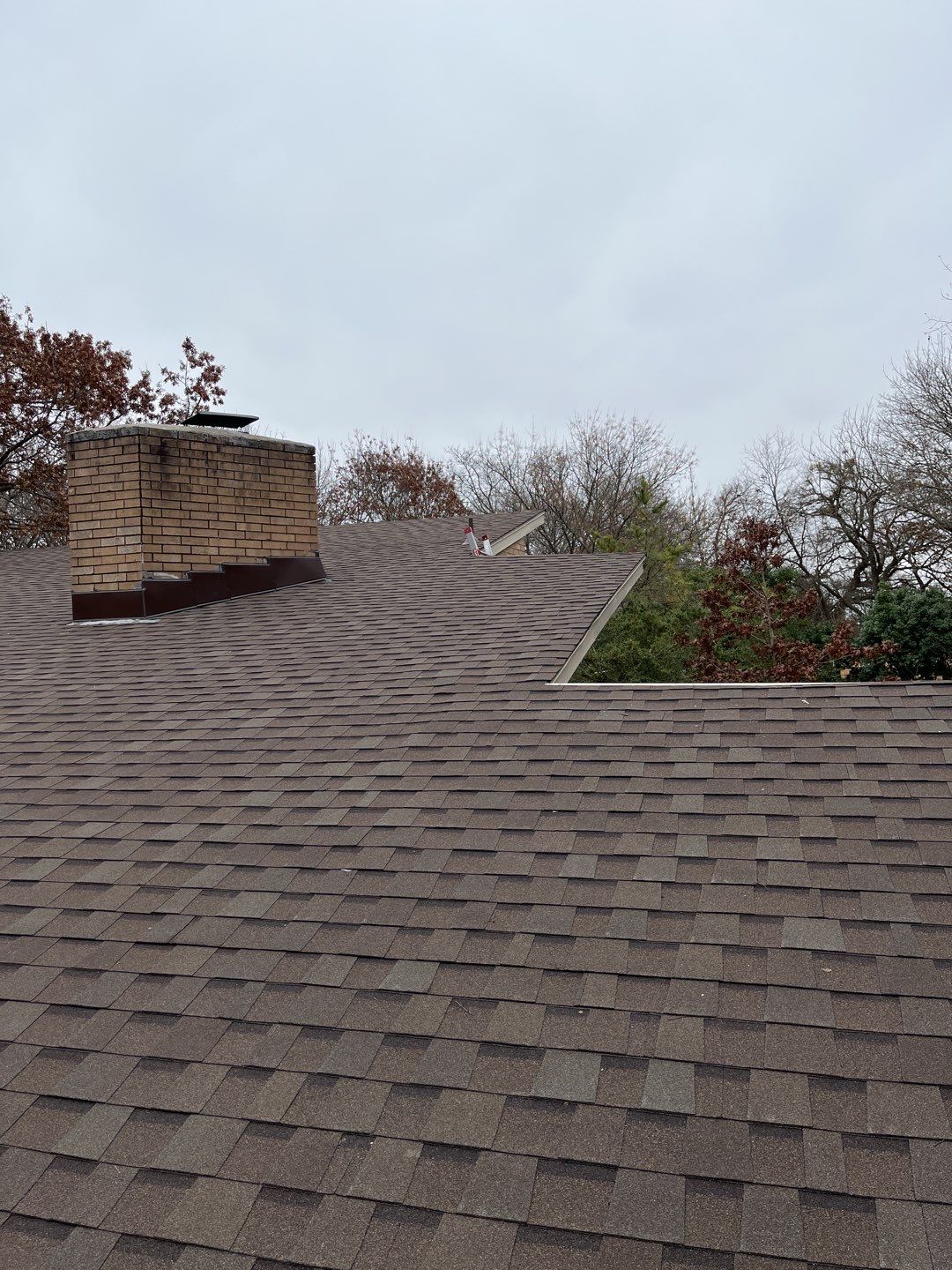 Residential Roofing Installation using Standing Seam Metal Roofing and Composition Shingles by Rainy Day Restoration