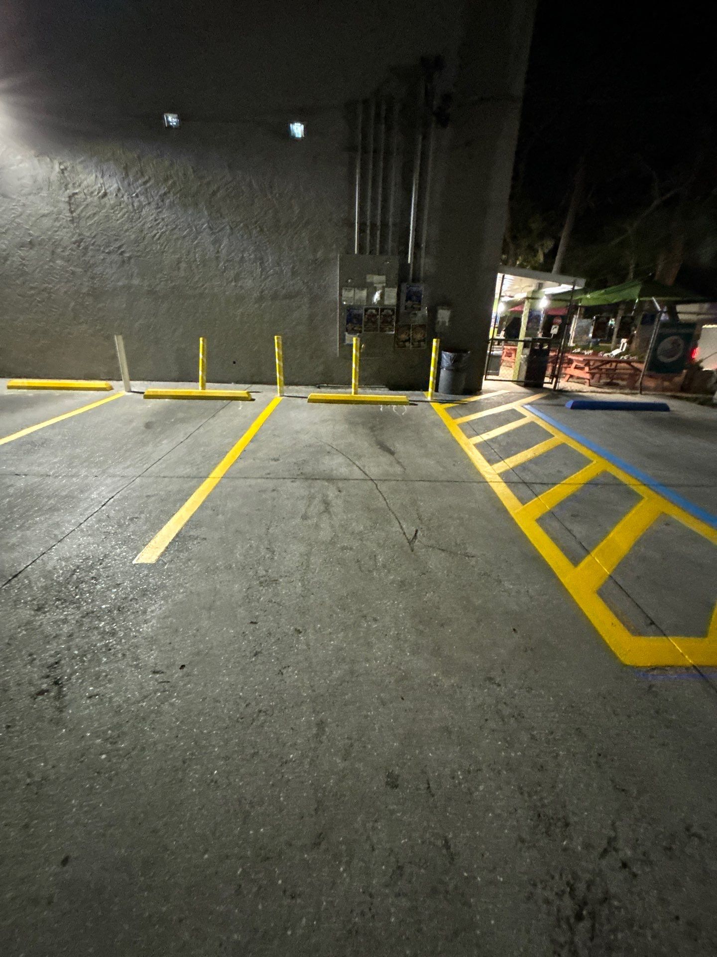 Bollard Installation, Line Striping, & Parking Block Installation at La Primavera Supermarket  by Everline Coatings & Services - Southwest FL