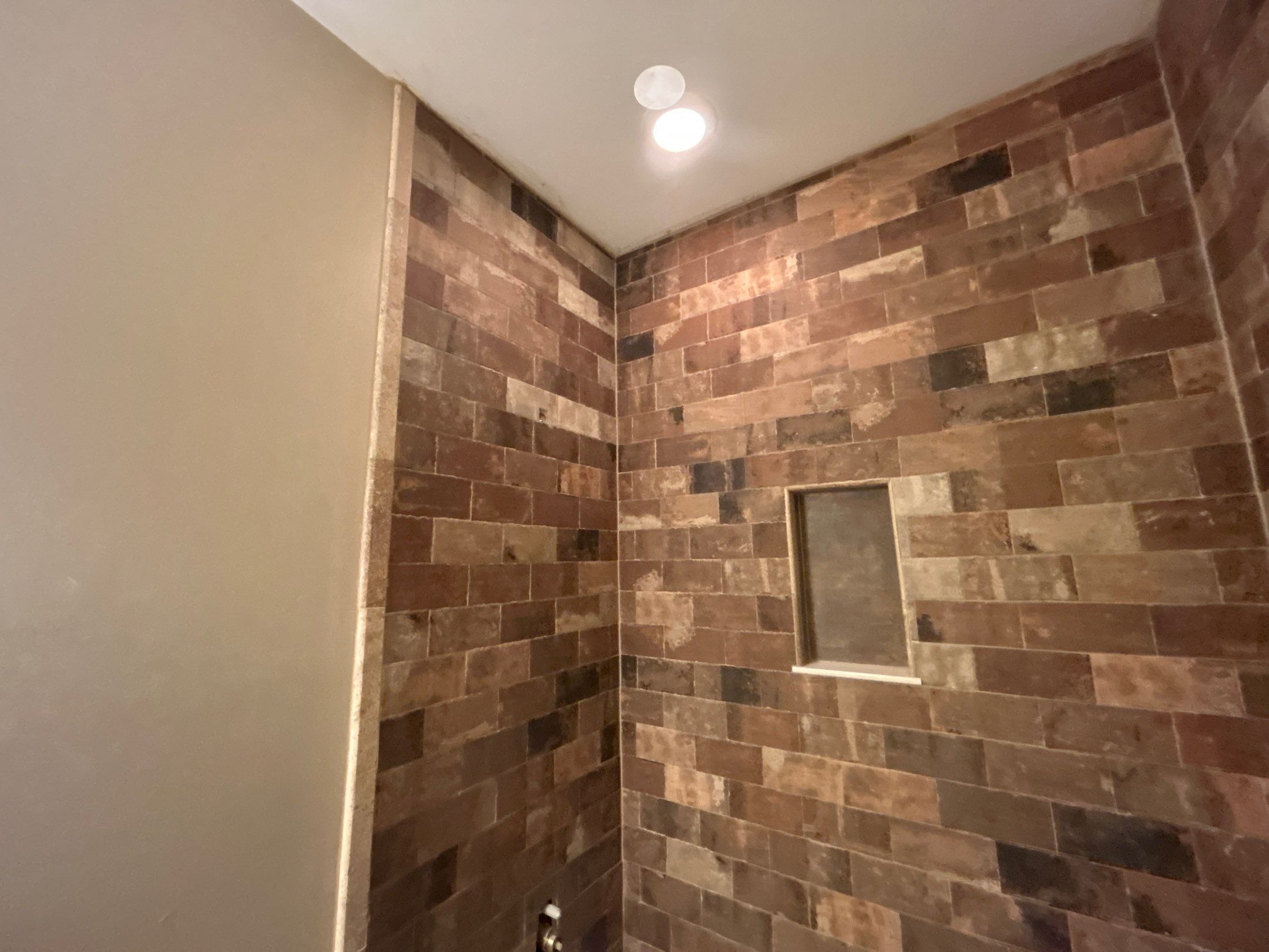 Tub Surround and Bathroom Floor by Footprints Floors Kentucky