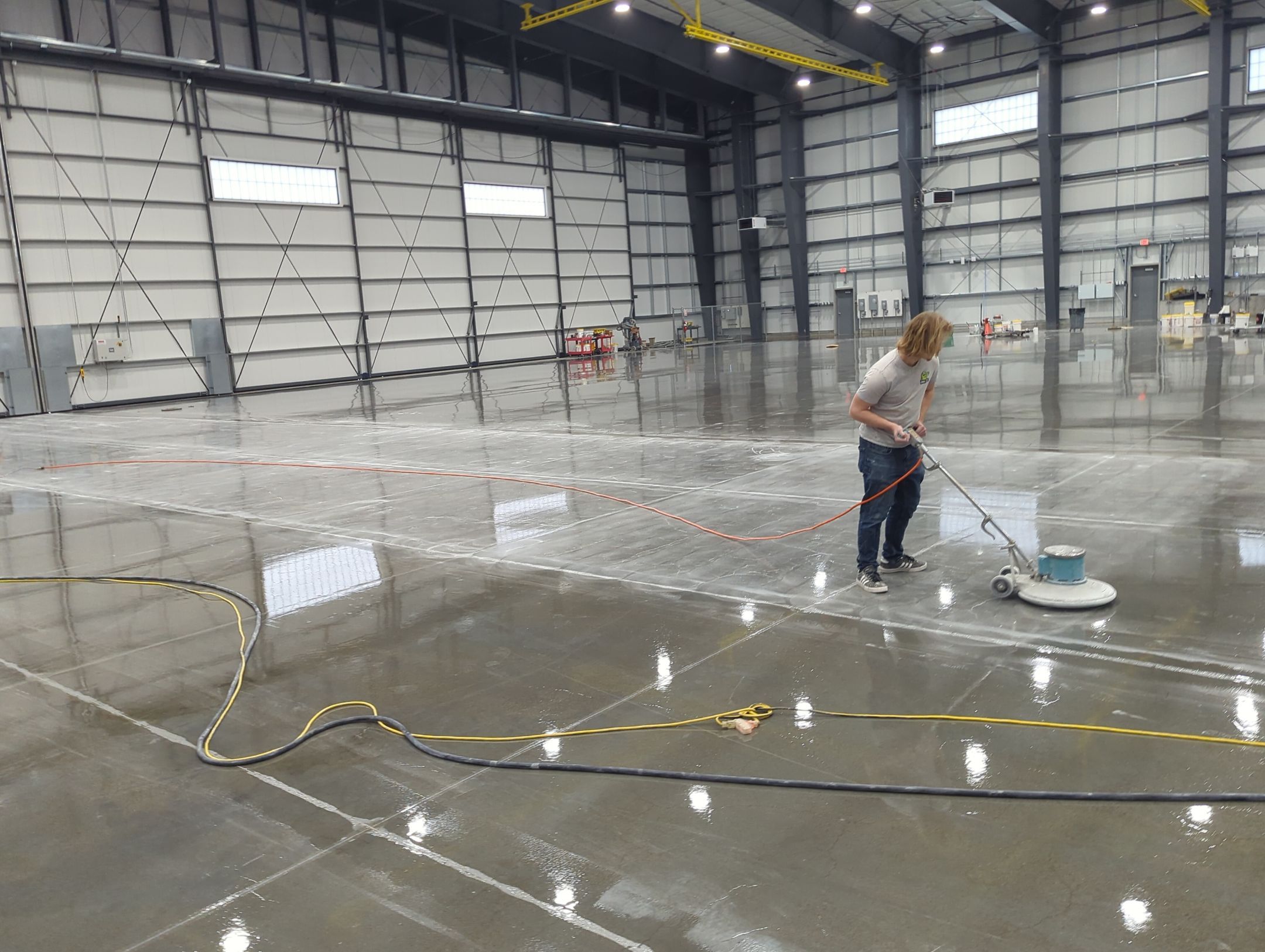 Airplane Hanger using Light Grey Commercial Penntek Epoxy by Croc Coatings, LLC