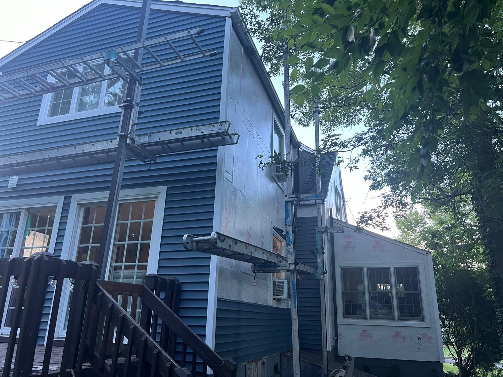 Complete Exterior Estate gray with Pacific Blue Siding by A Plus Exterior
