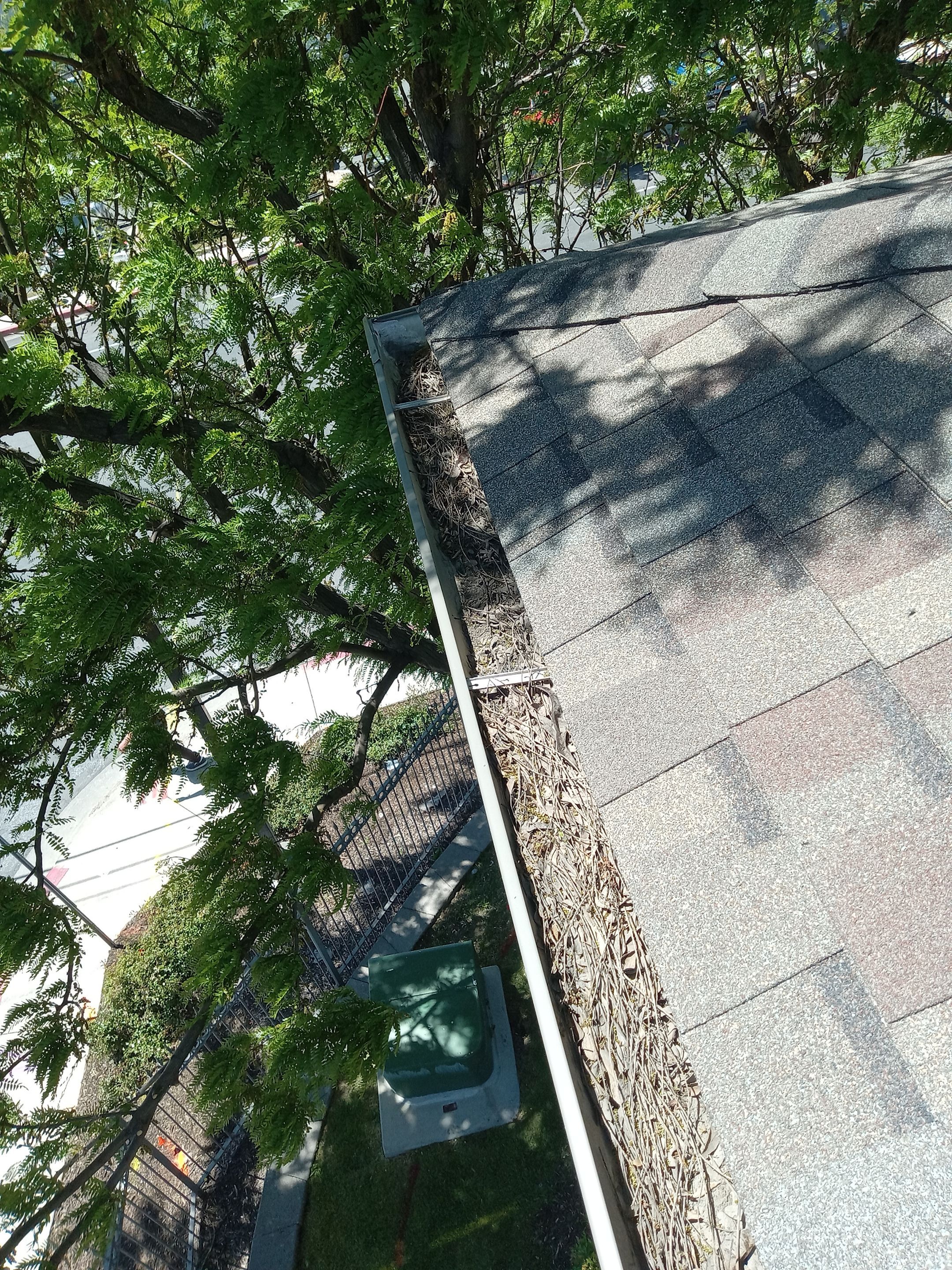 Commercial gutter cleaning Provo & Orem, UT before photo with filled gutters