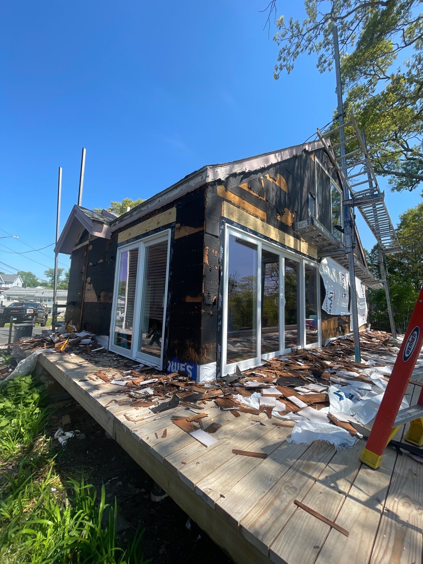 Milford Exterior Renovation Featuring Custom Siding and Wood Deck Installation by A Plus Exterior