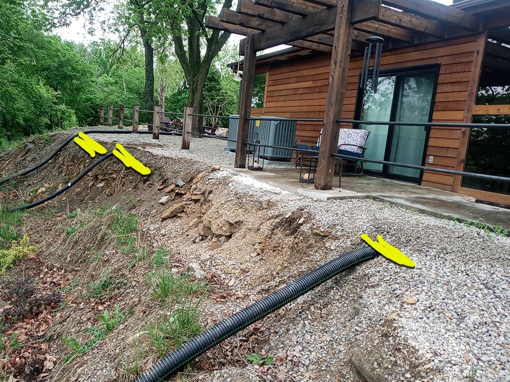Supporting back of home with backfill at edge of steep creek by LAND ESCAPES LLC