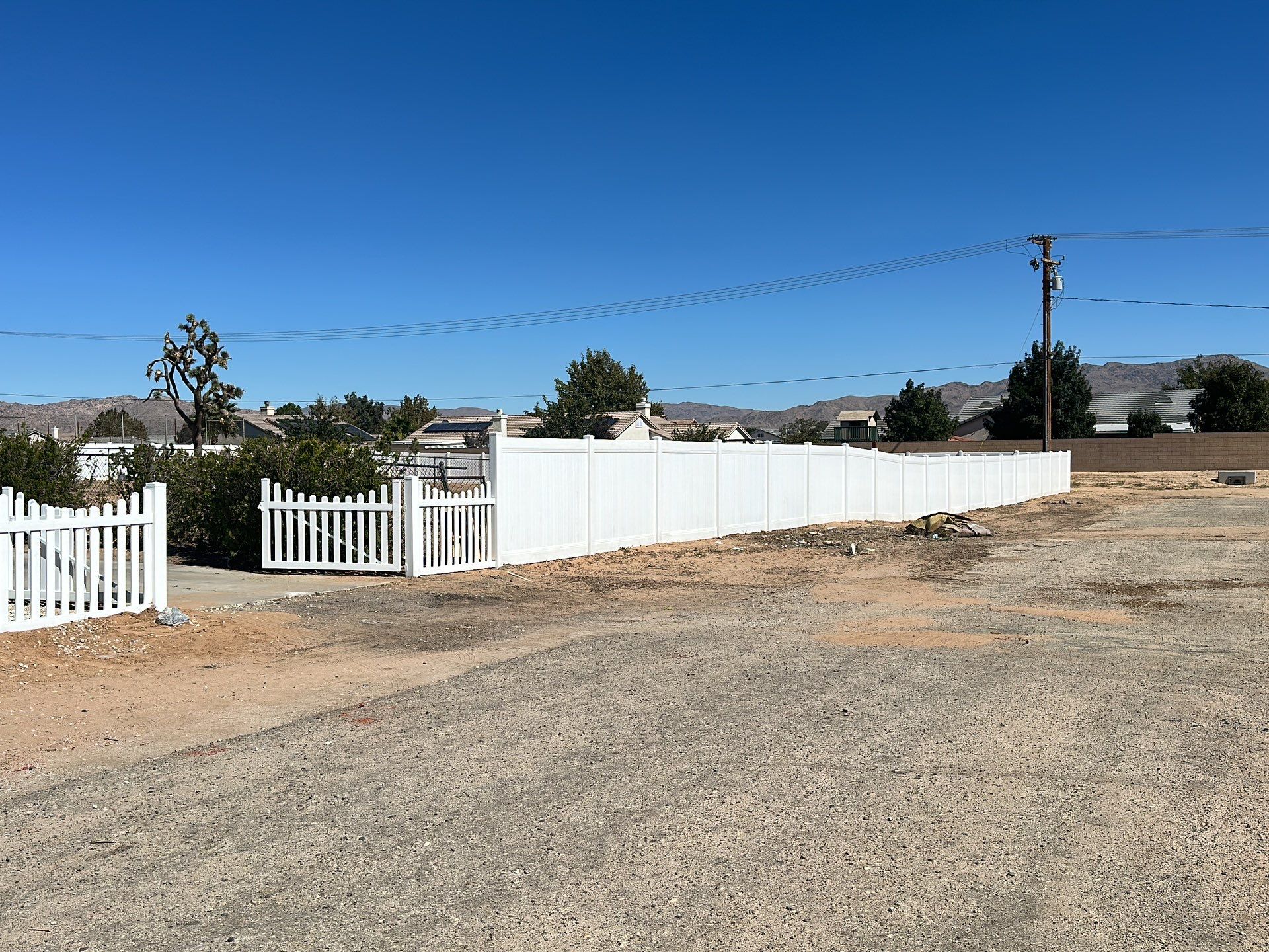 White picket fence  by Fence Guys Inc. 