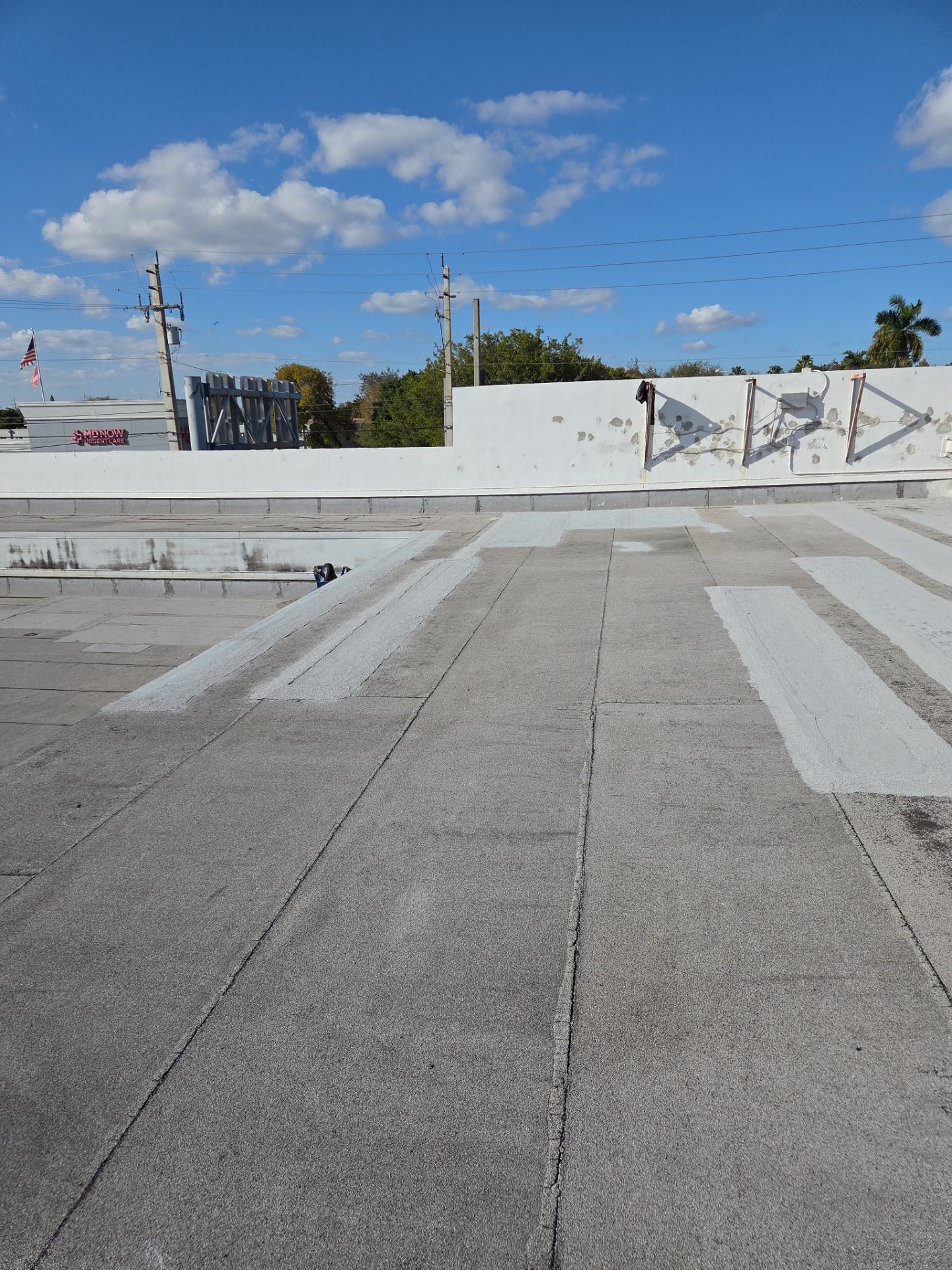 Commercial Flat Roof Restoration Using Silicone Coating in Hallandale Beach by Aastro Roofing
