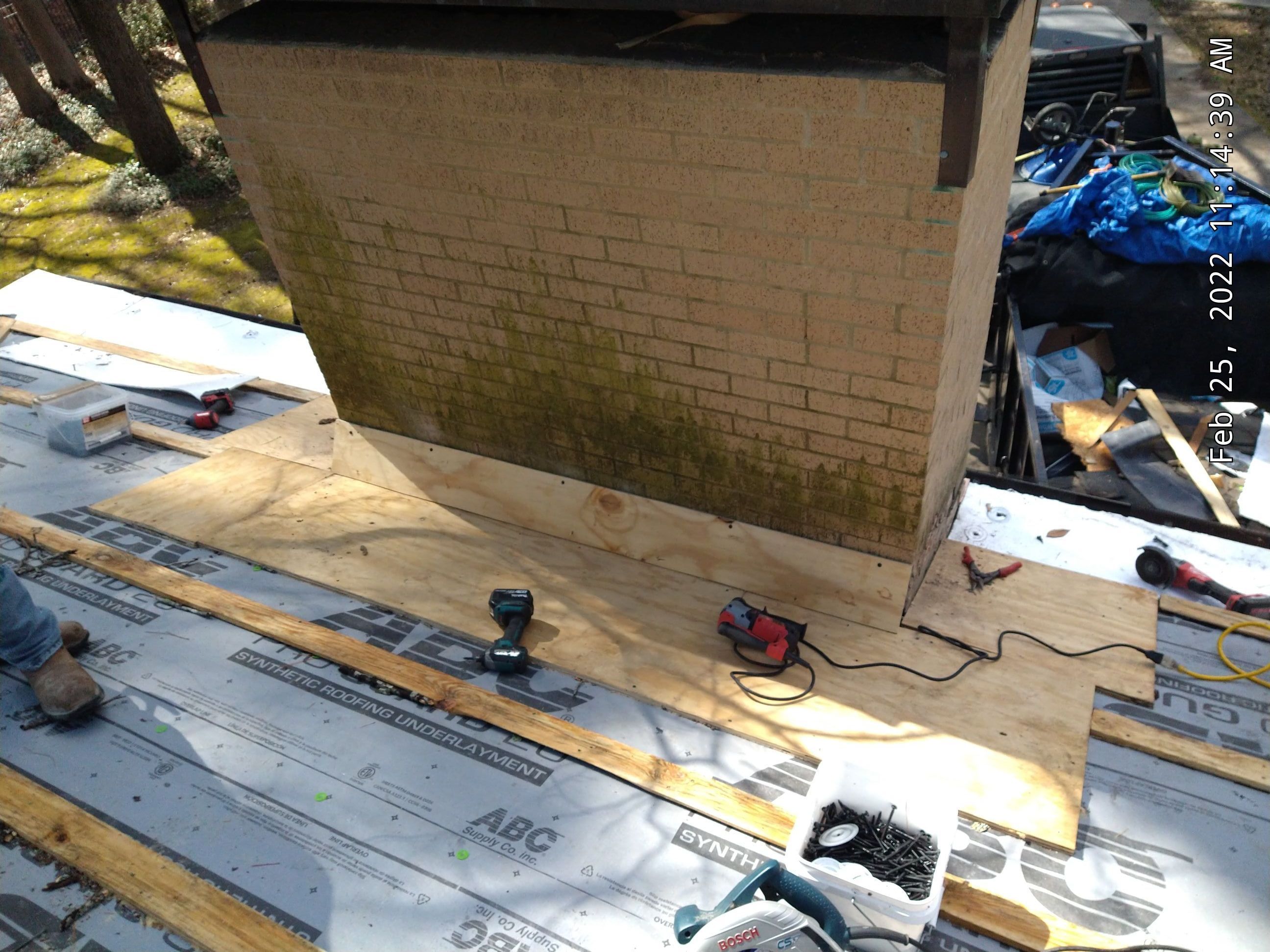 Residential Roofing Installation using PVC membrane and 24 gauge Standing Seam Metal by Hostetler Roofing