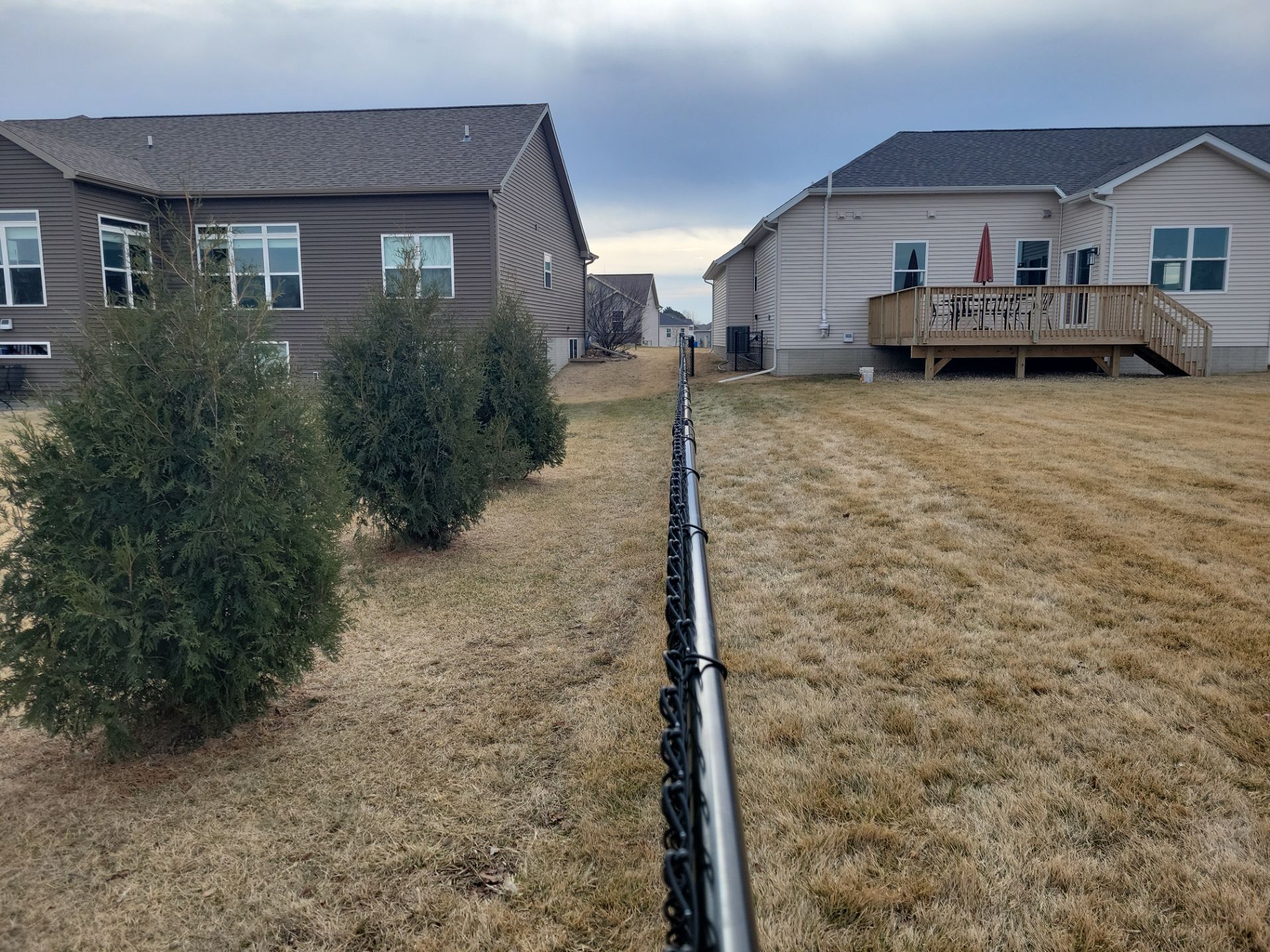Black Chain Link Fence and Gate Installation in Cedar Falls by Perfect Picket Fence and Stain
