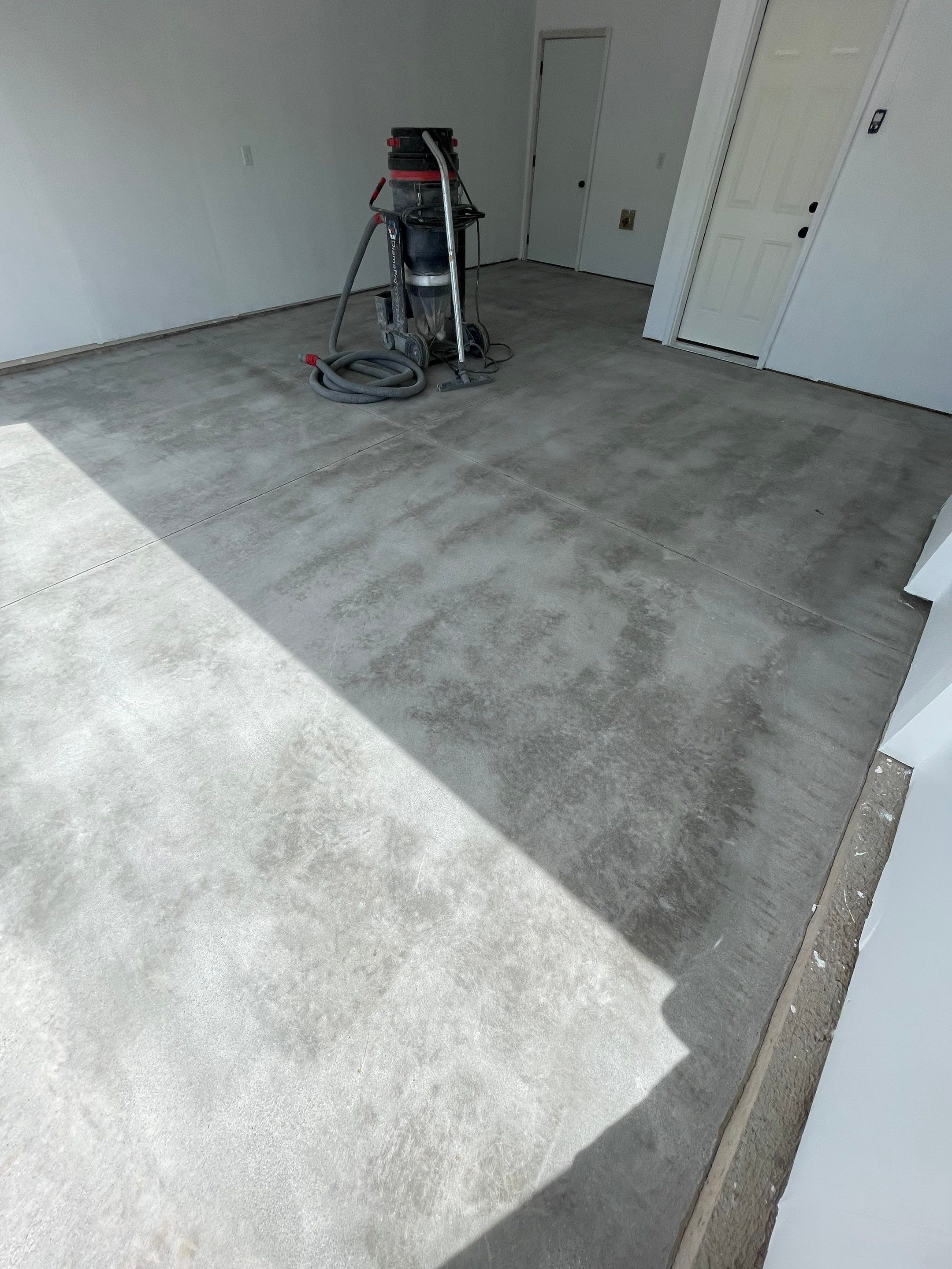 Sioux Falls Garage Floor Transformation with Cabin Fever Decorative Chips by Select Painting, Coatings & Garage Cabinets