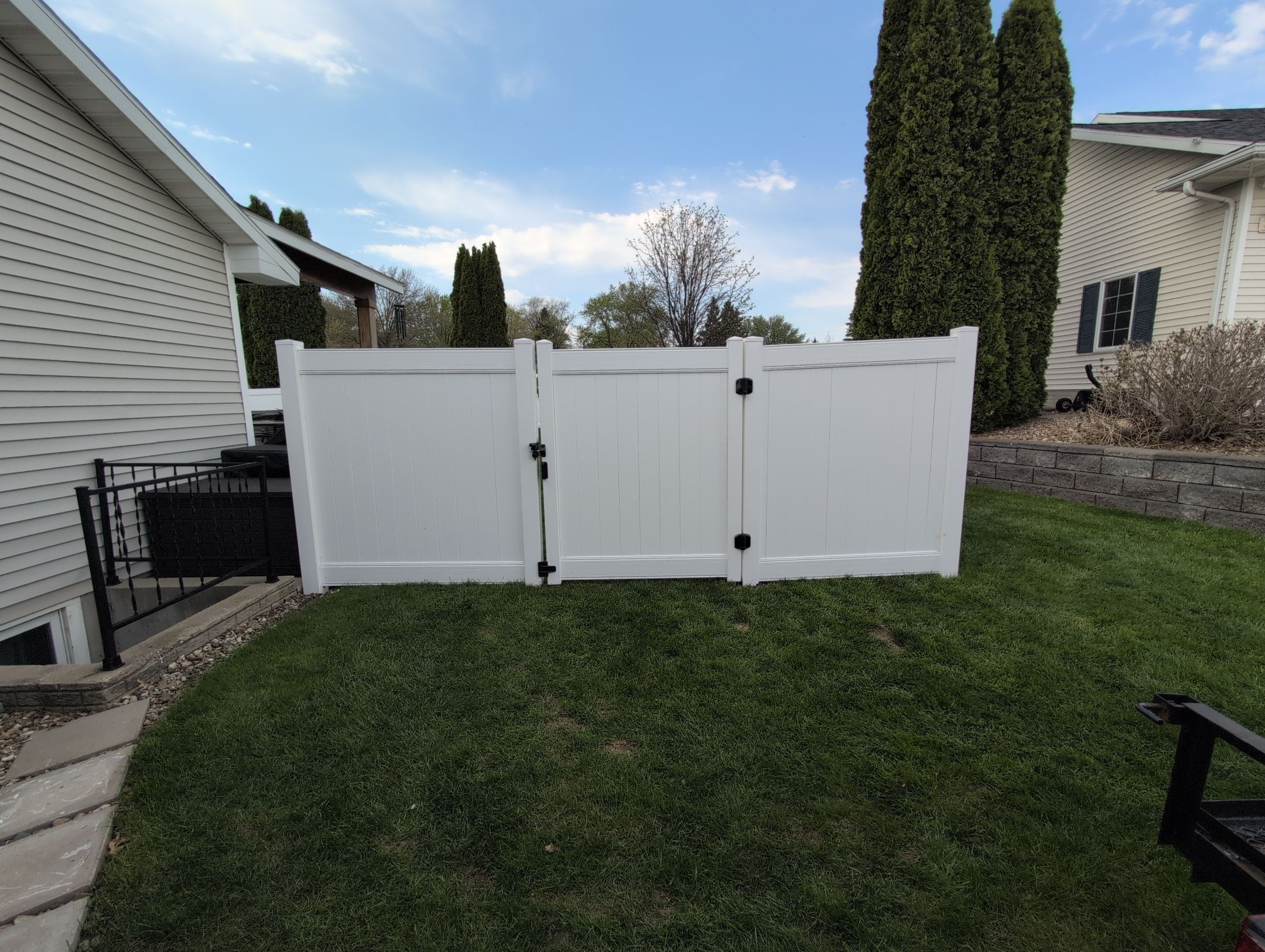 White Vinyl Privacy Fence Installation in Raymond, Iowa by Perfect Picket Fence and Stain
