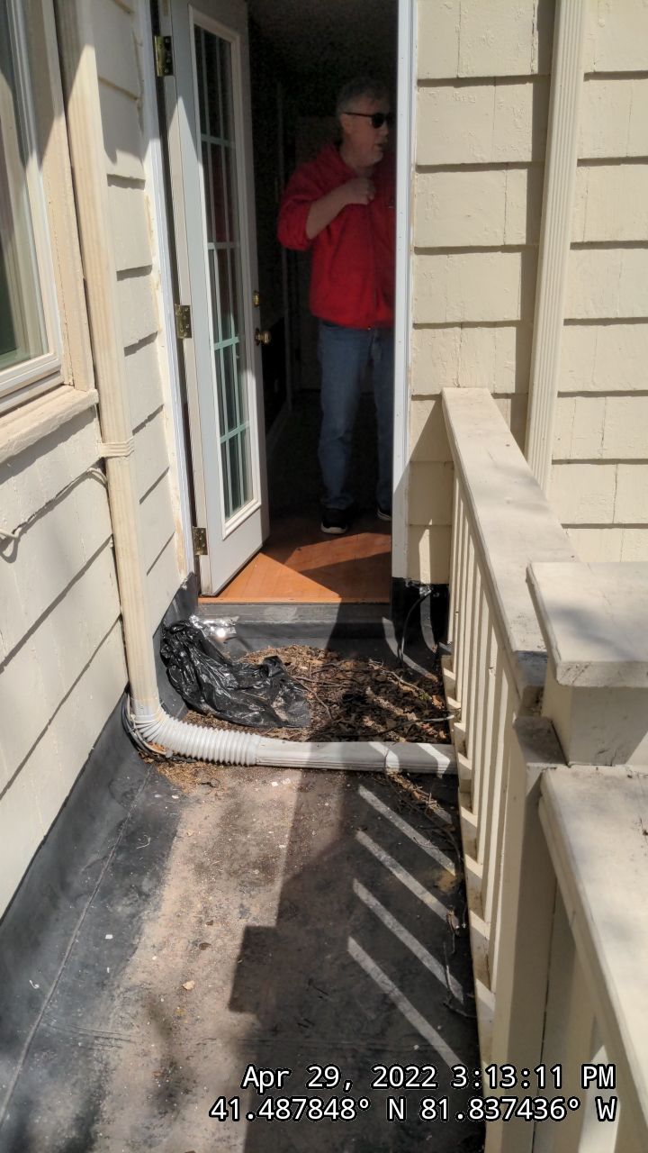 Residential Roofing Installation, Dec-tek walk-out porch roof, siding on garage by Absolute Roofing and Construction
