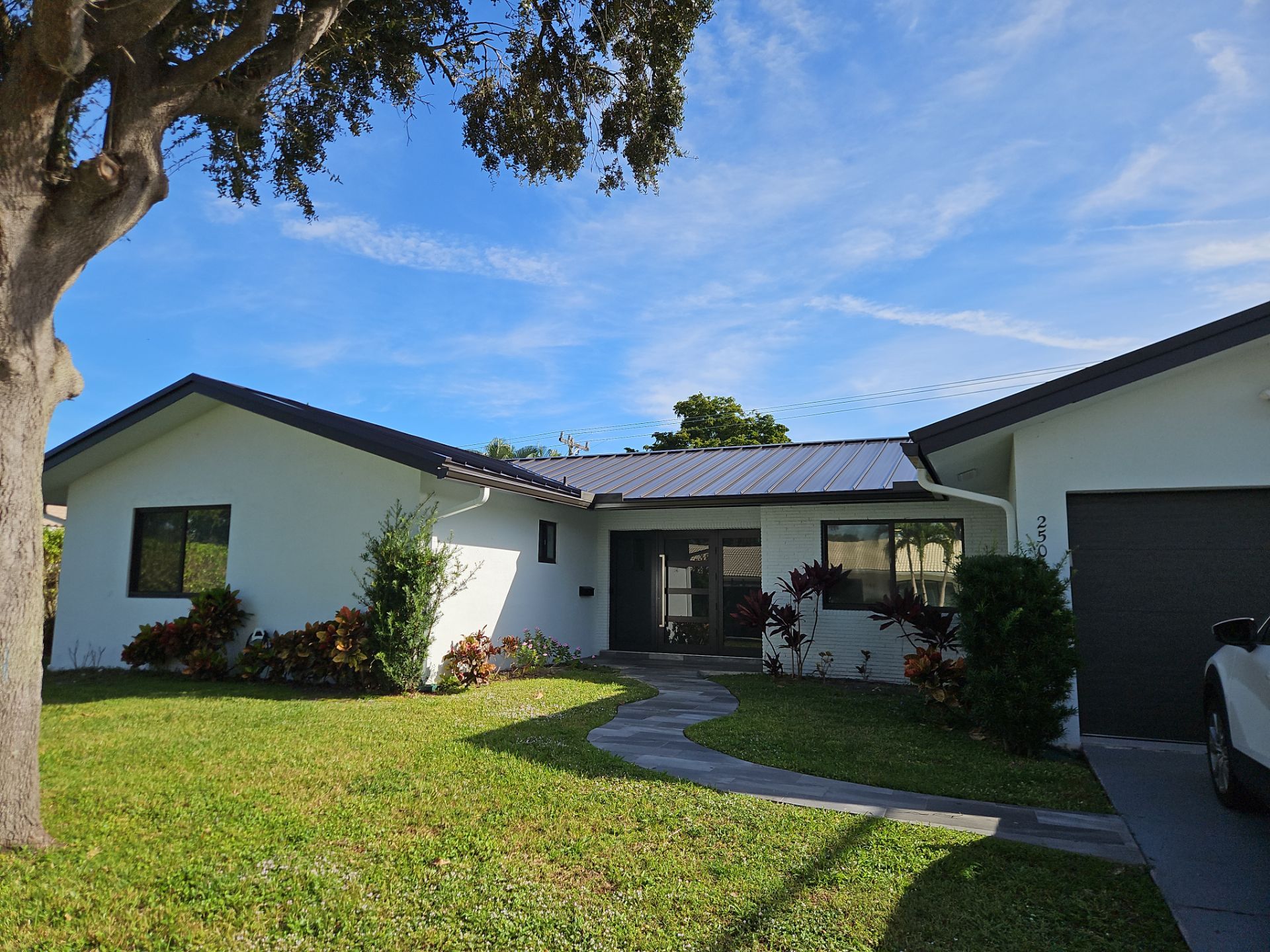 Residential Roofing Installation using 1" Nail strip metal roof by BLUES BROTHERS CONSTRUCTION CORP