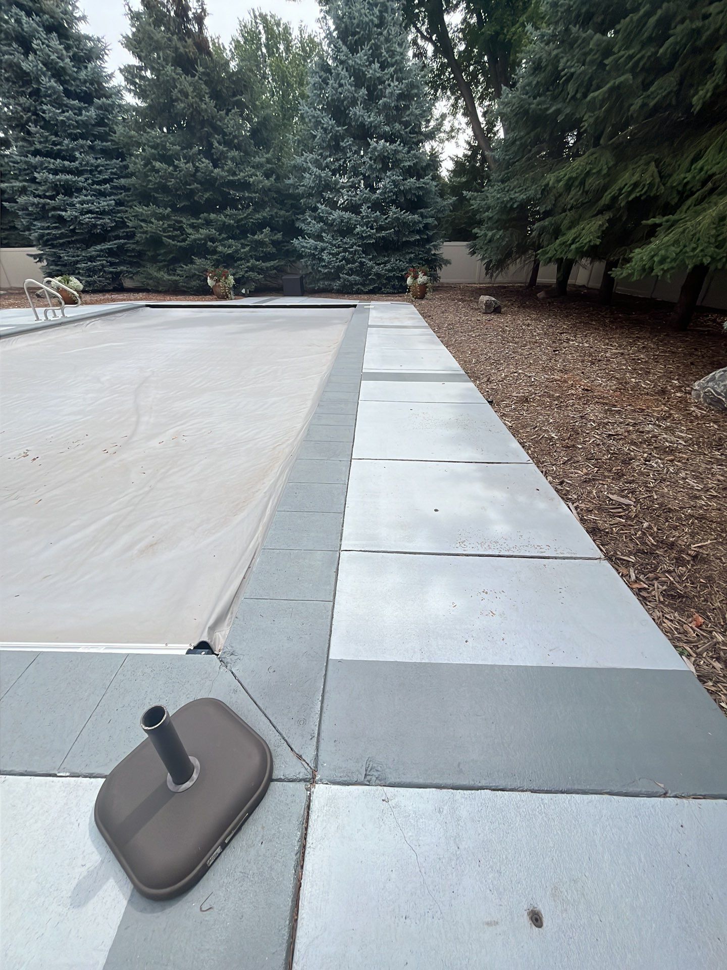 Decorative Concrete Pool Deck and Patio Resurfacing in Sioux Falls by Select Painting, Coatings & Garage Cabinets