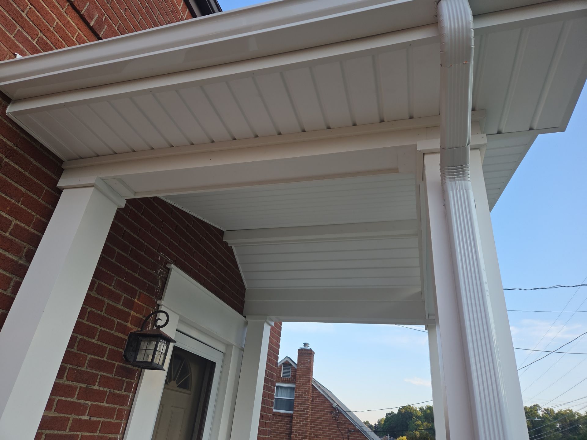 Concret and roof build  by Cousins Roofing Siding & Decks