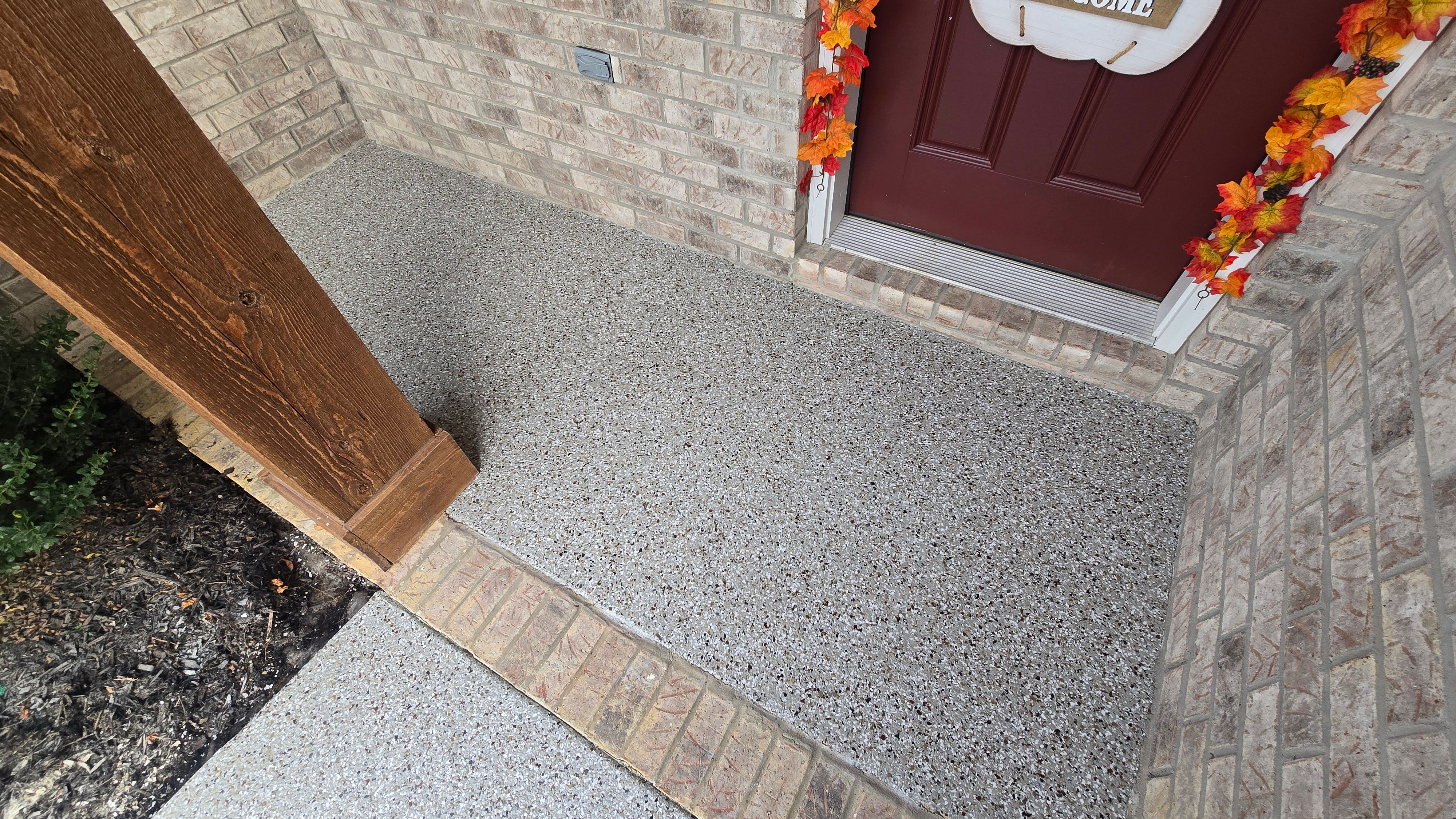 Sidewalk, Porch, and Back Patio Using Creekbed and Nordic Green by Elite Floor Solutions