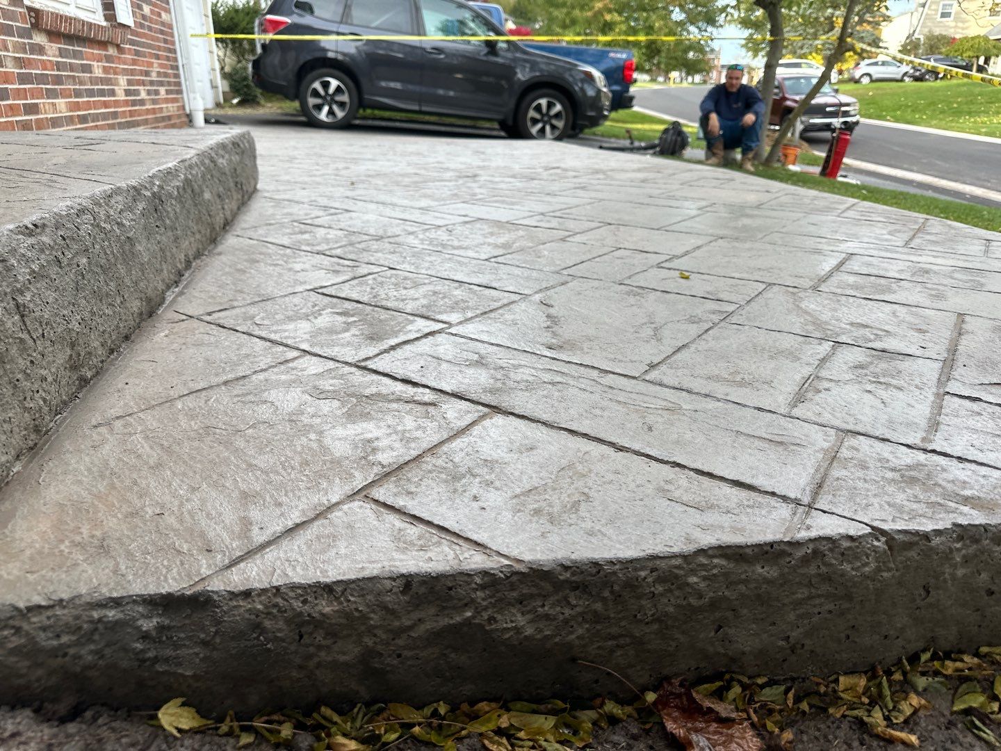 Ashlar slate stamped concrete patio  by NG Masonry & Construction LLC