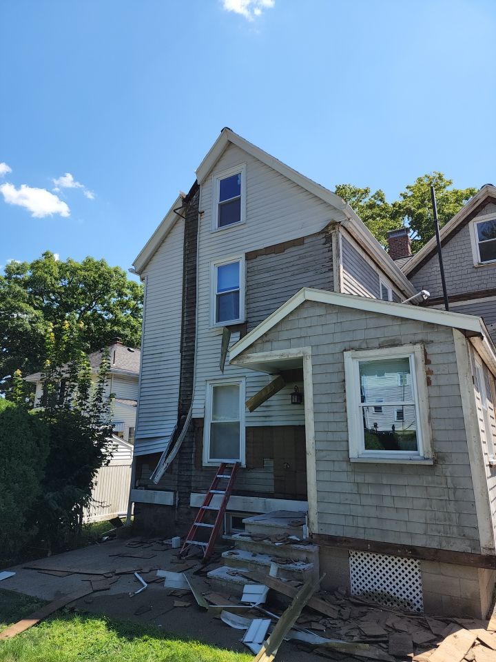 Vinyl siding layover project for 2 family in Wellesley, MA by UBrothers Construction