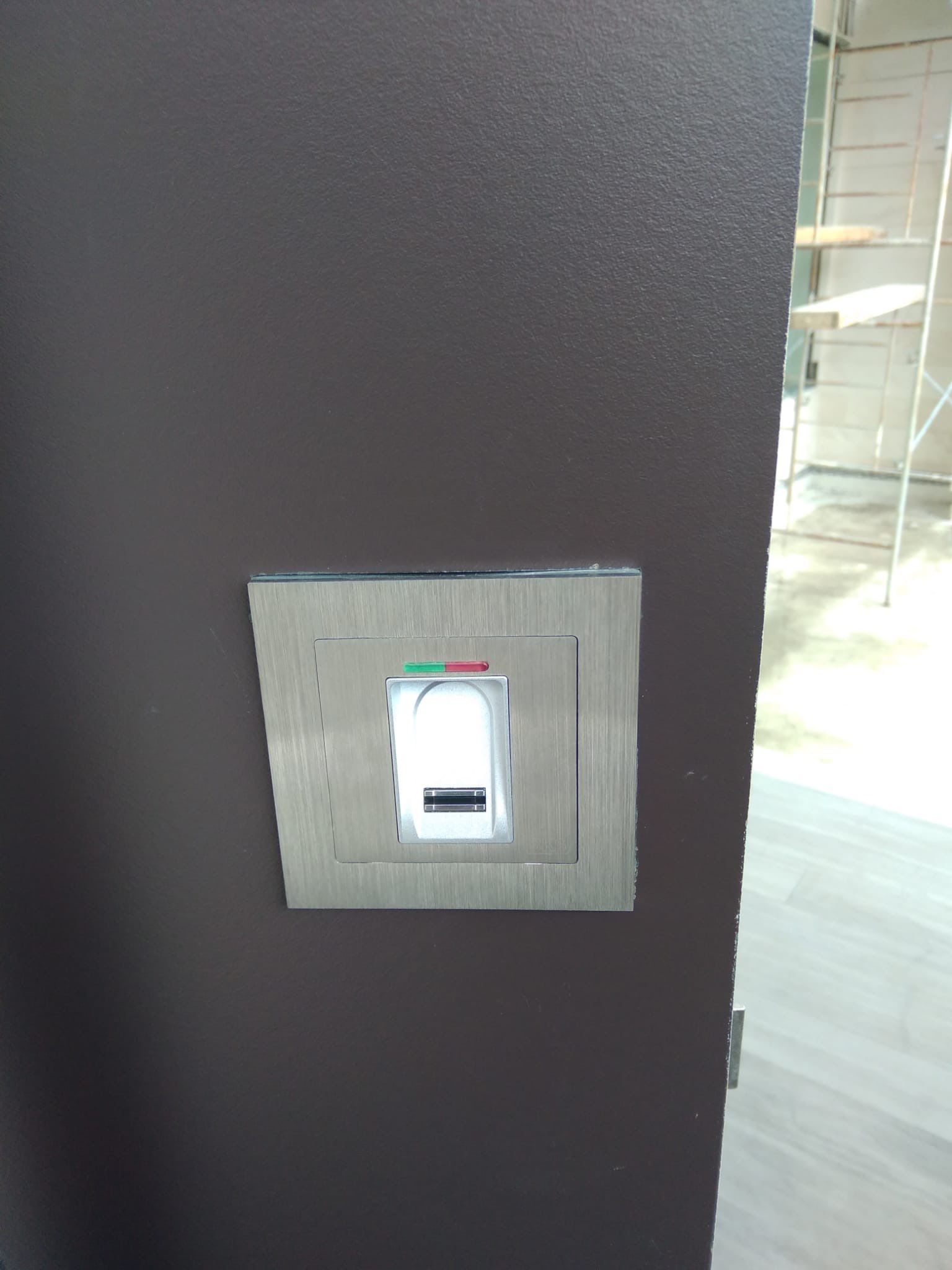 Custom Material Pivot Door installation by Impact Precious Wood Inc.