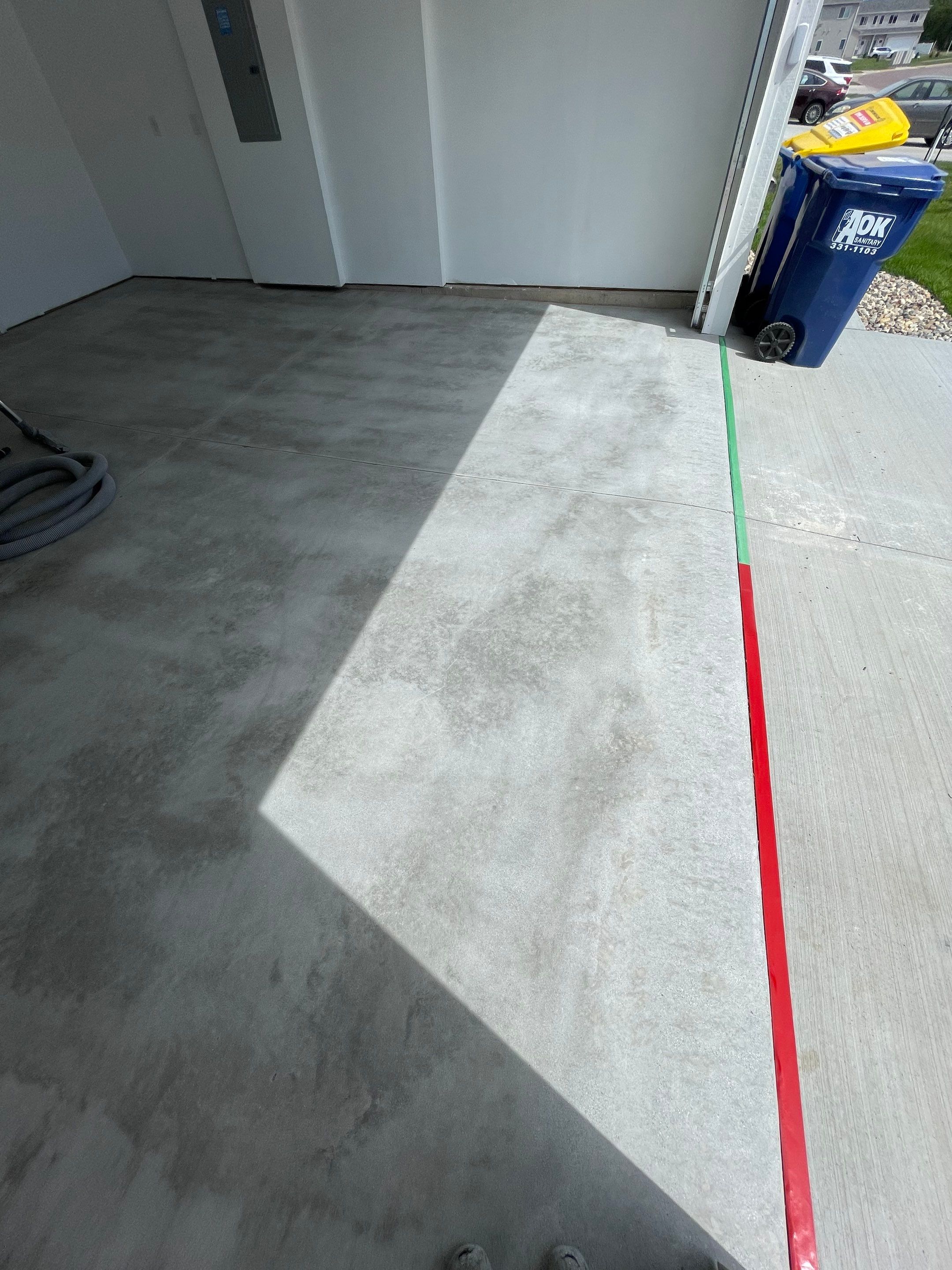 Sioux Falls Garage Floor Transformation with Cabin Fever Decorative Chips by Select Painting, Coatings & Garage Cabinets