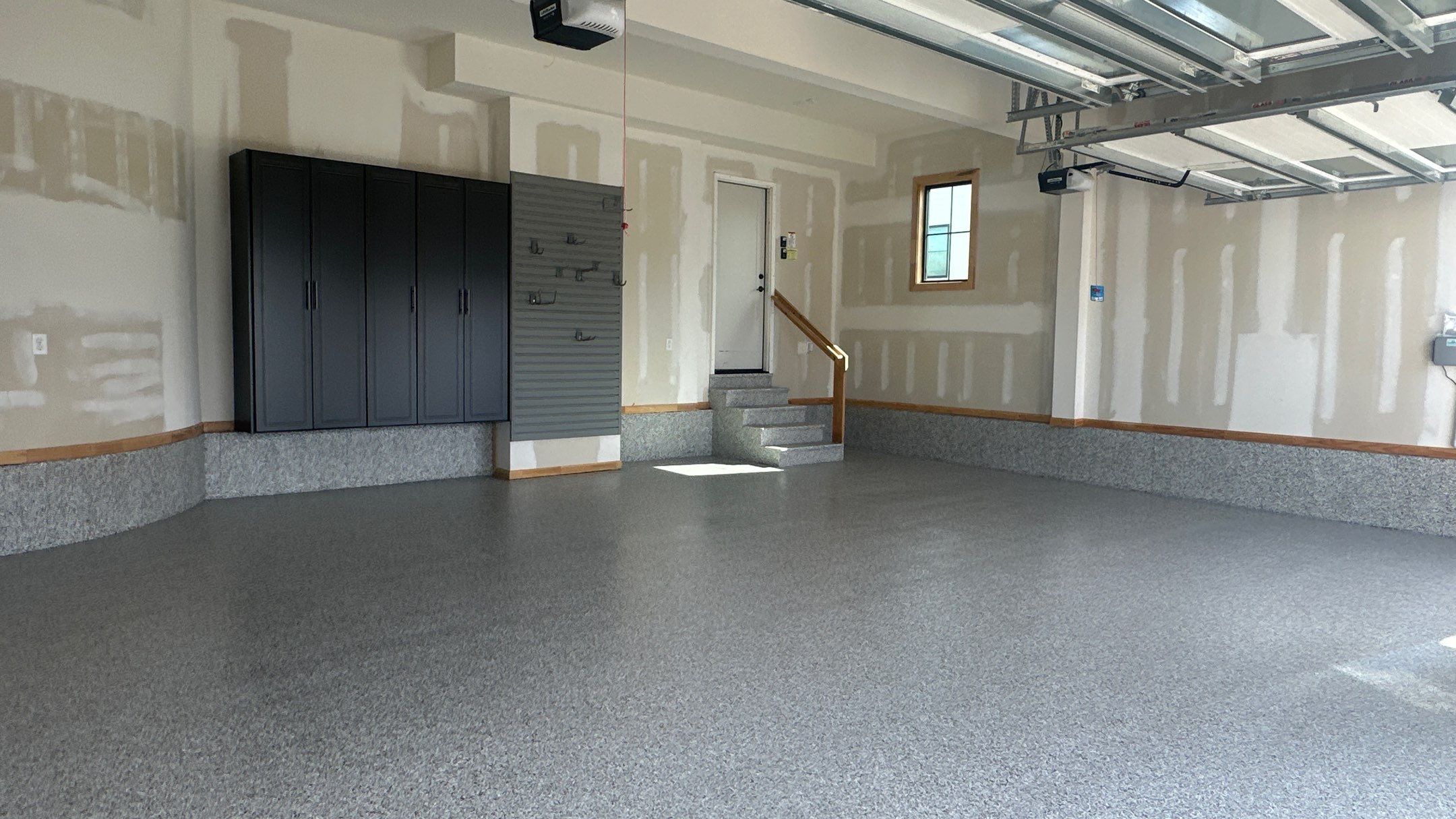 Megan J. added cabinets and slotwall to her garage. Plus a New Floor by Banner Garage