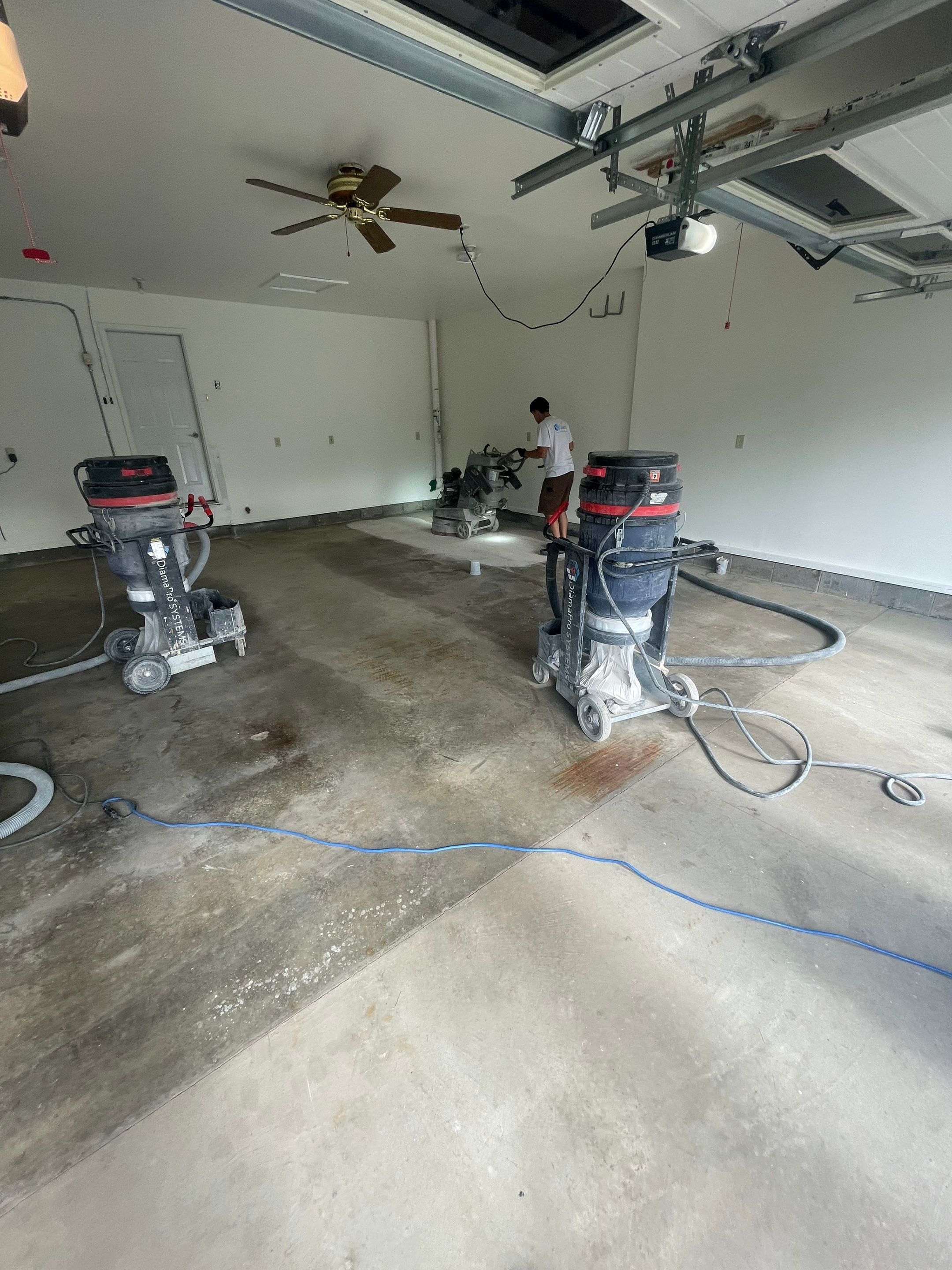 Madison Garage Concrete Coating with Feather Grey Speckle Finish by Select Painting, Coatings & Garage Cabinets