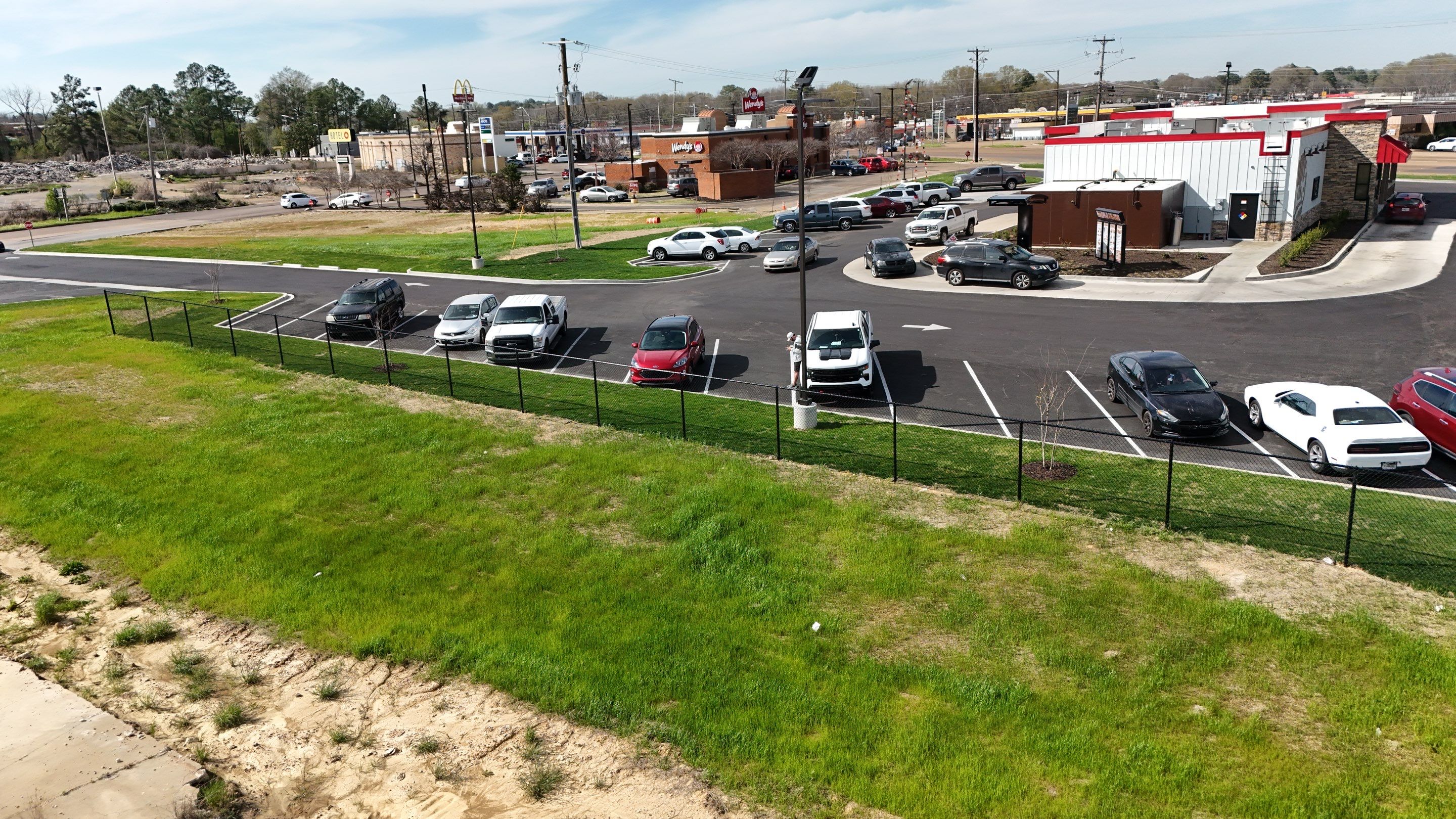 6' Black Chain Link Fence & Concrete Block Dumpster Enclosure by Roberson Construction LLC