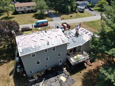 Complete Roof Replacement with Chimney Flashing, Gutter Guard System, and Vinyl Siding Repairs