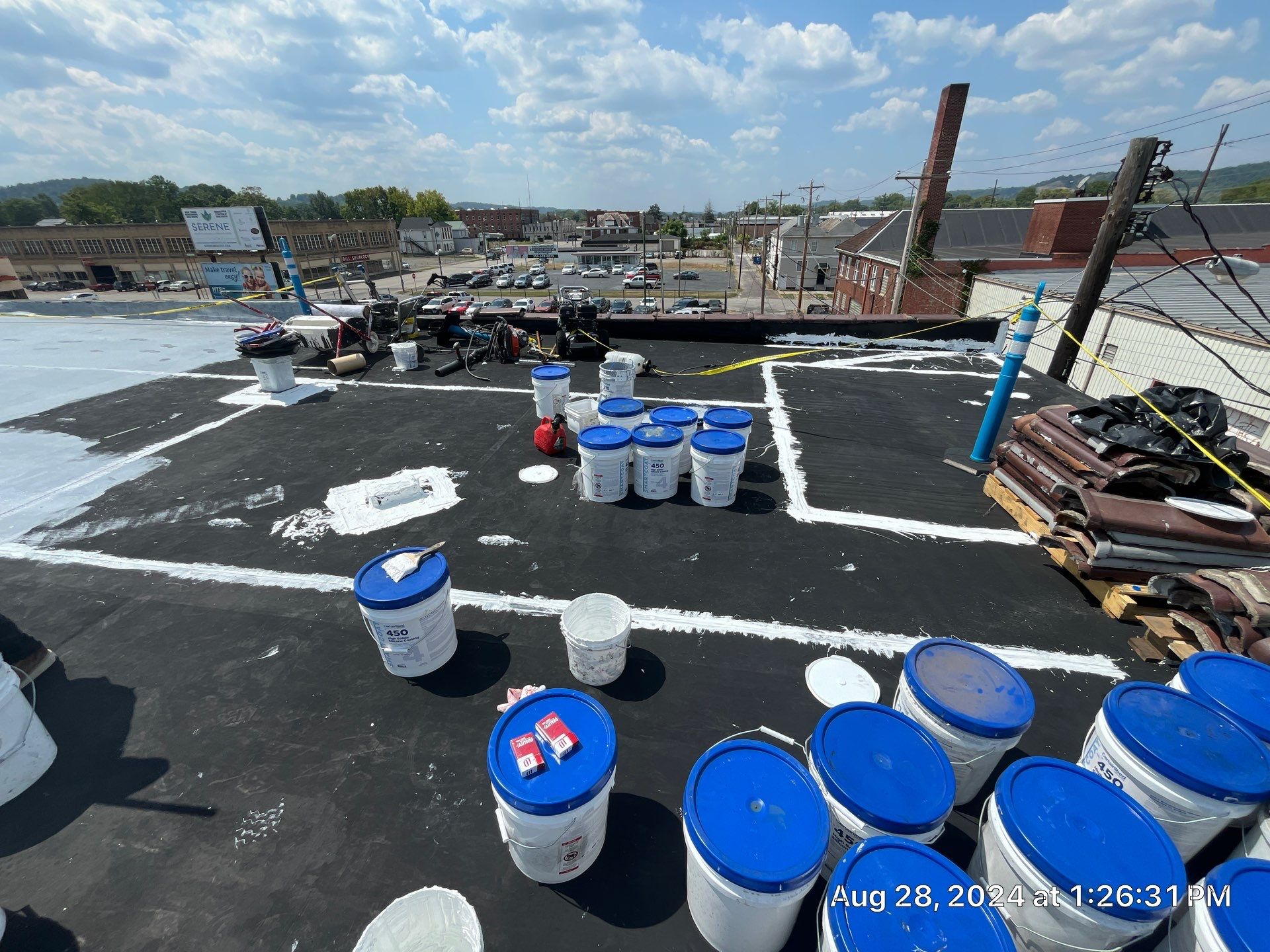 Commercial Roofing Installation using smartcoat Roof coating by Fahey Roofing + Contracting
