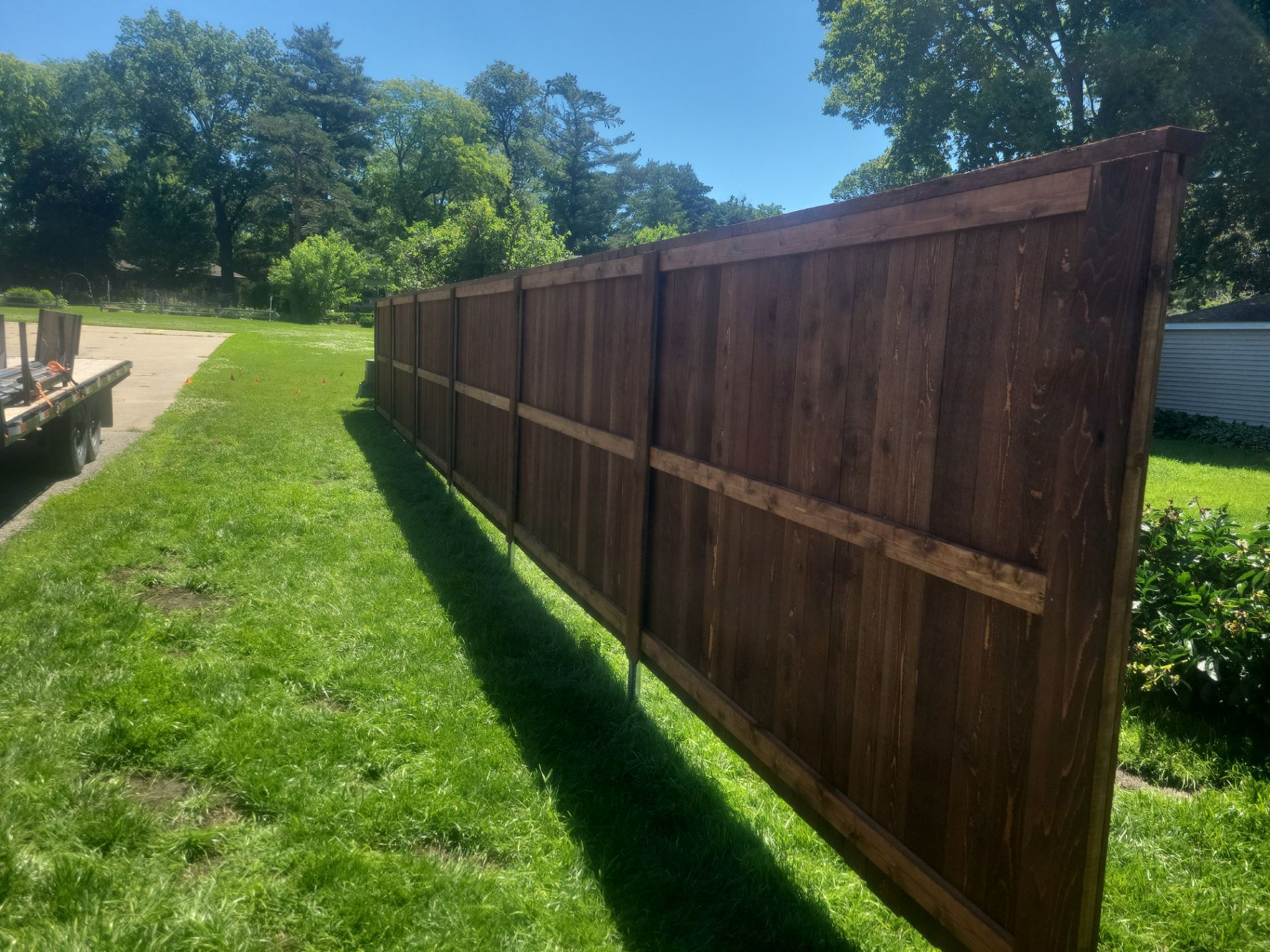 Custom Stained Cedar Chestnut Privacy Fence Installation in Cedar Falls by Perfect Picket Fence and Stain