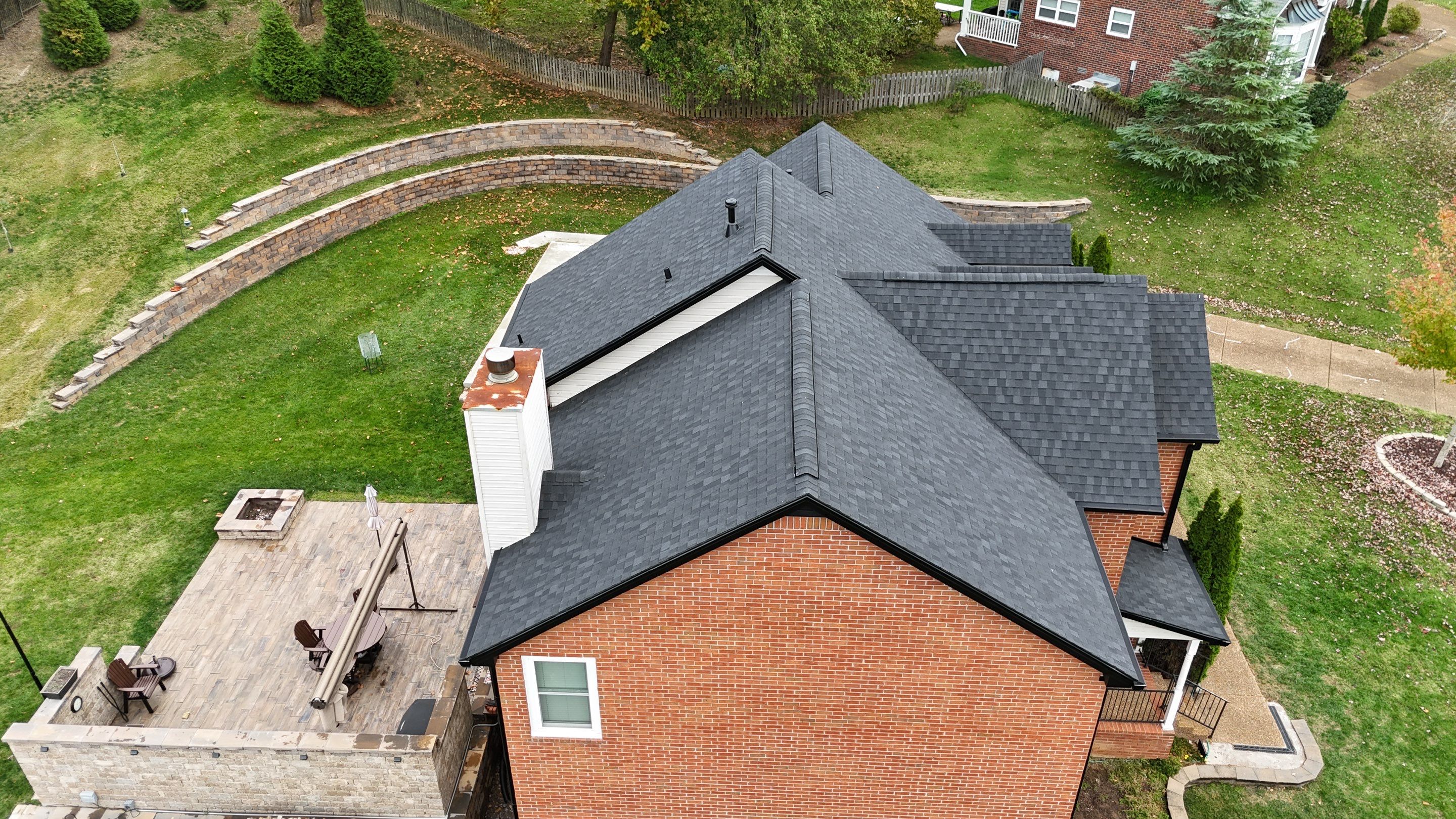Charcoal Black Re-Roof & Gutters by Royal House LLC