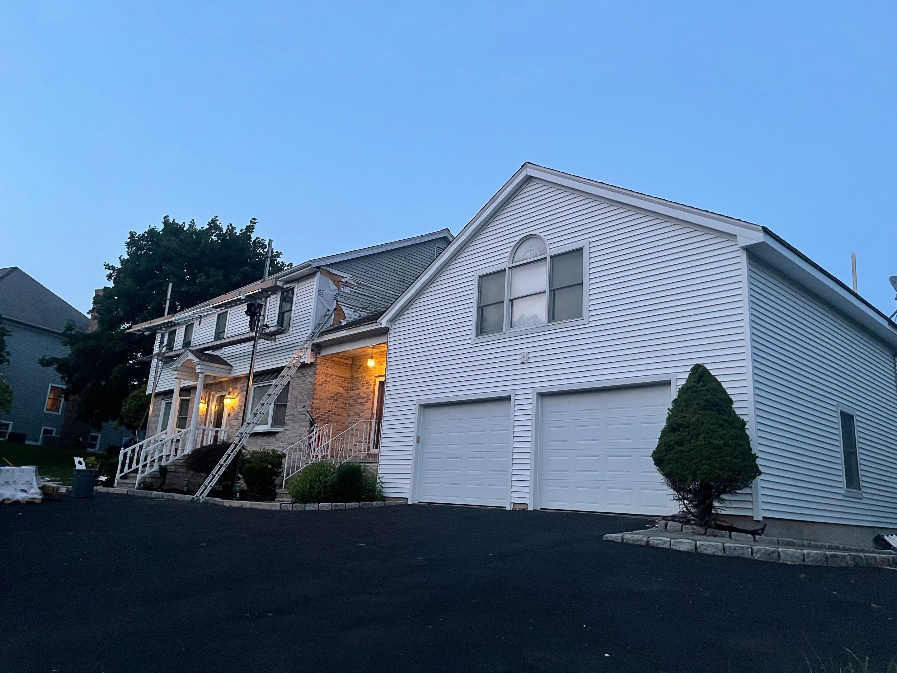 Siding Installation using Mainstreet Colonial & White gutters by A Plus Exterior