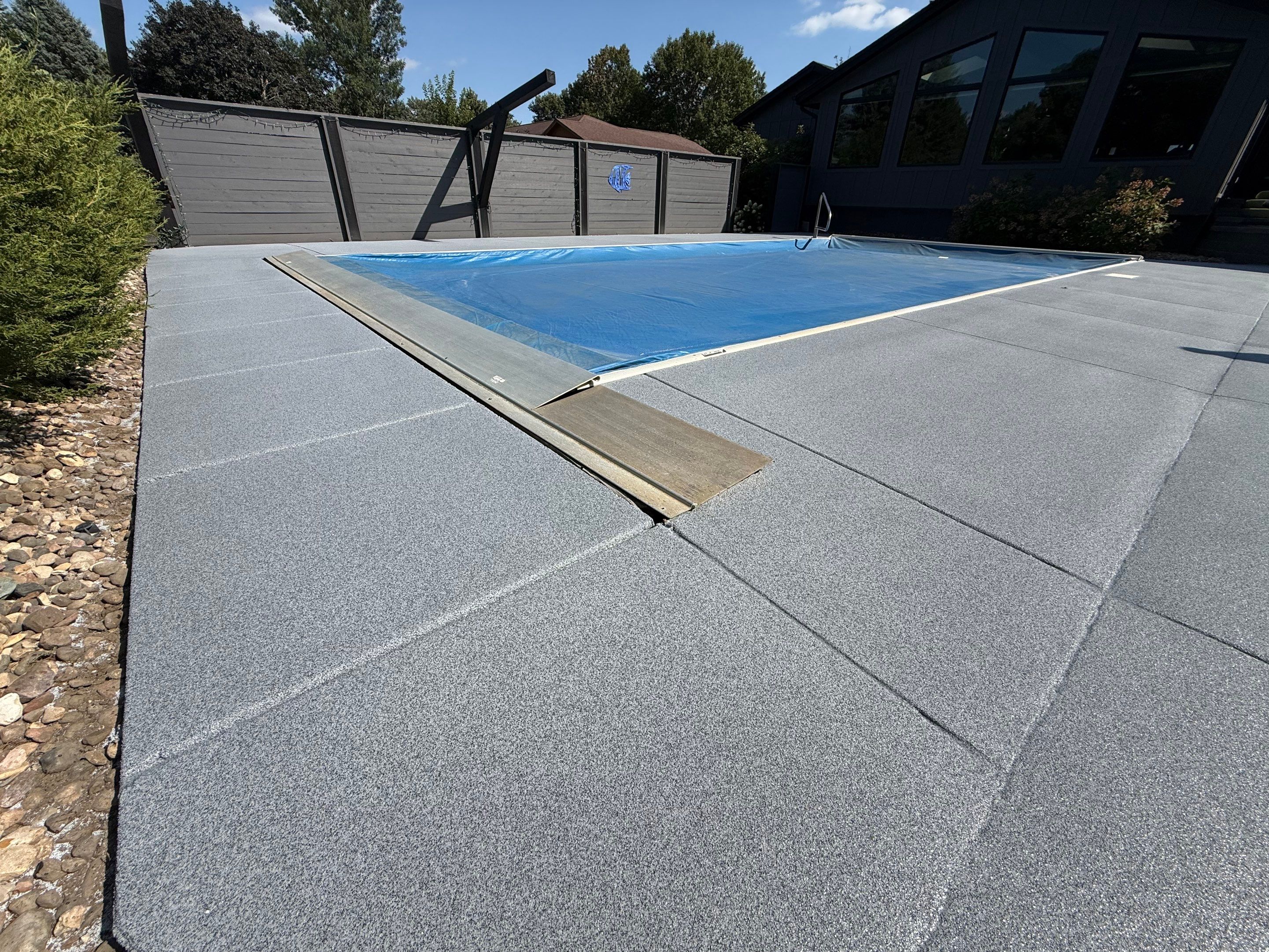 Garage Floor and Textured Pool Deck Coating in Sioux Falls by Select Painting, Coatings & Garage Cabinets