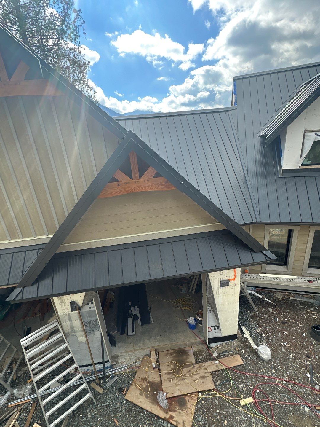 Residential Roofing Installation using 12" Prolok metal by Top Notch Roofing Inc