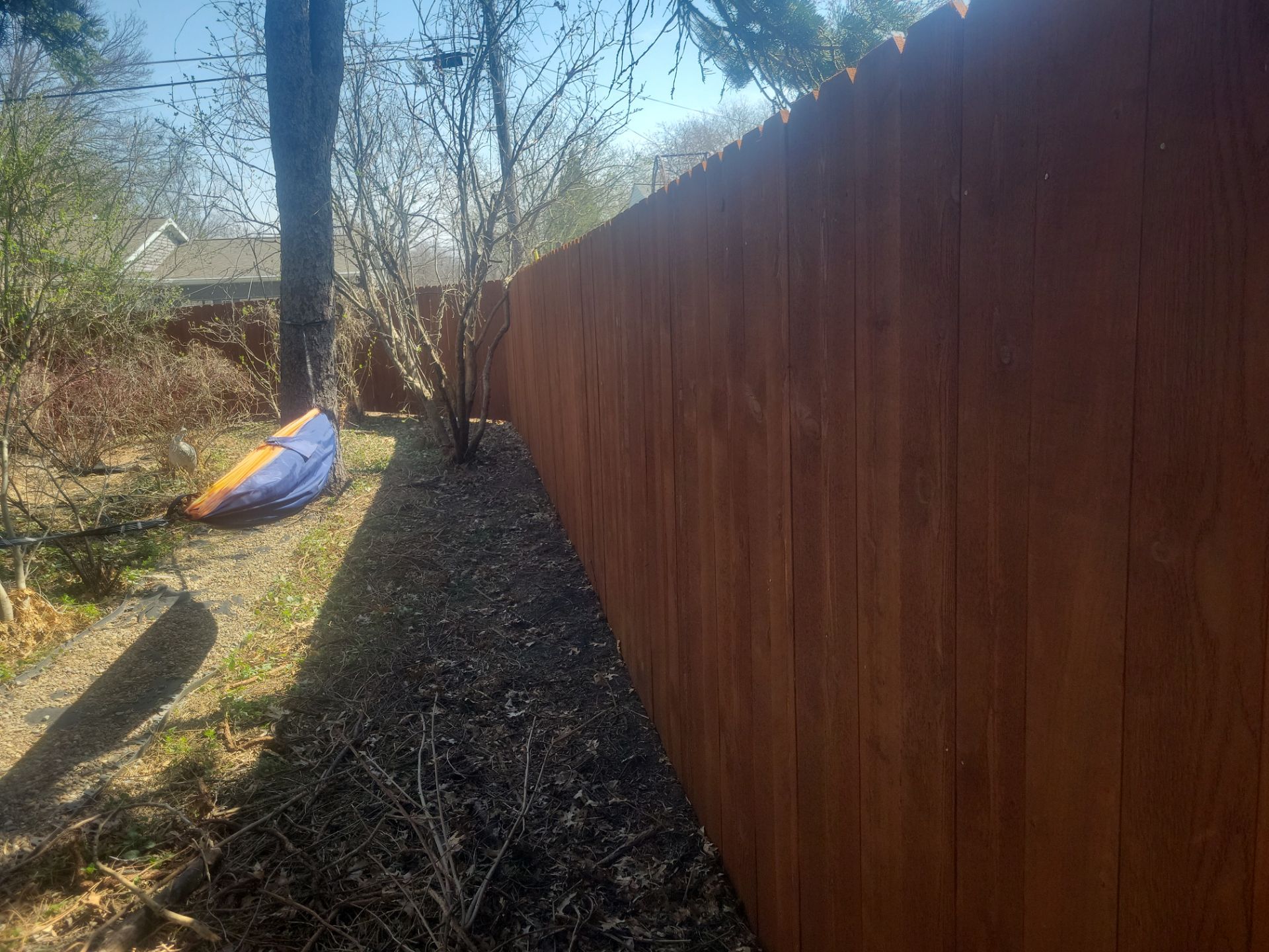 Stained Cedar Wood Privacy Fence Installation in Cedar Falls by Perfect Picket Fence and Stain