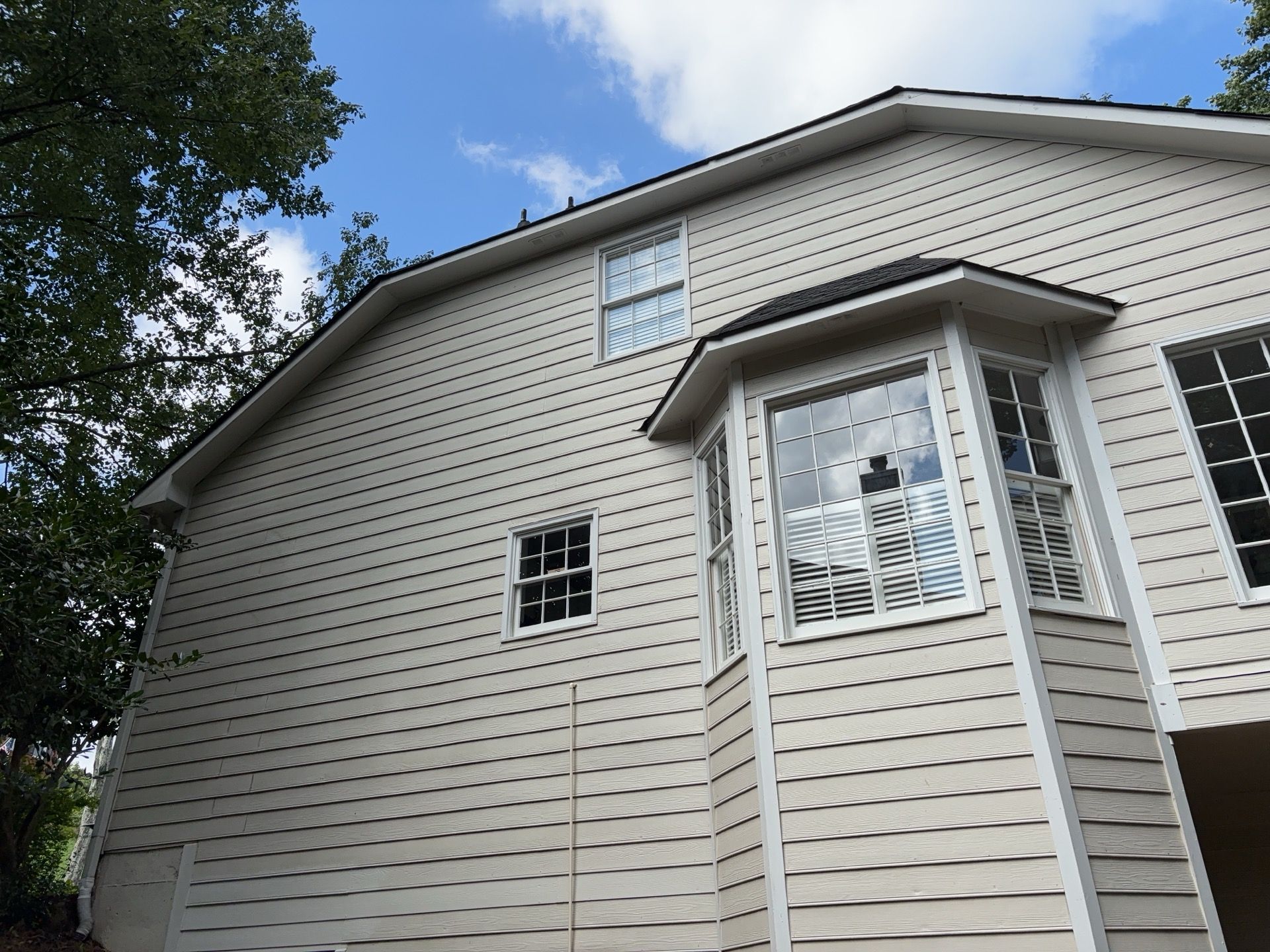 Blue Exterior Paint and Siding Installation using James Hardie Lap Siding by Nelson Exteriors