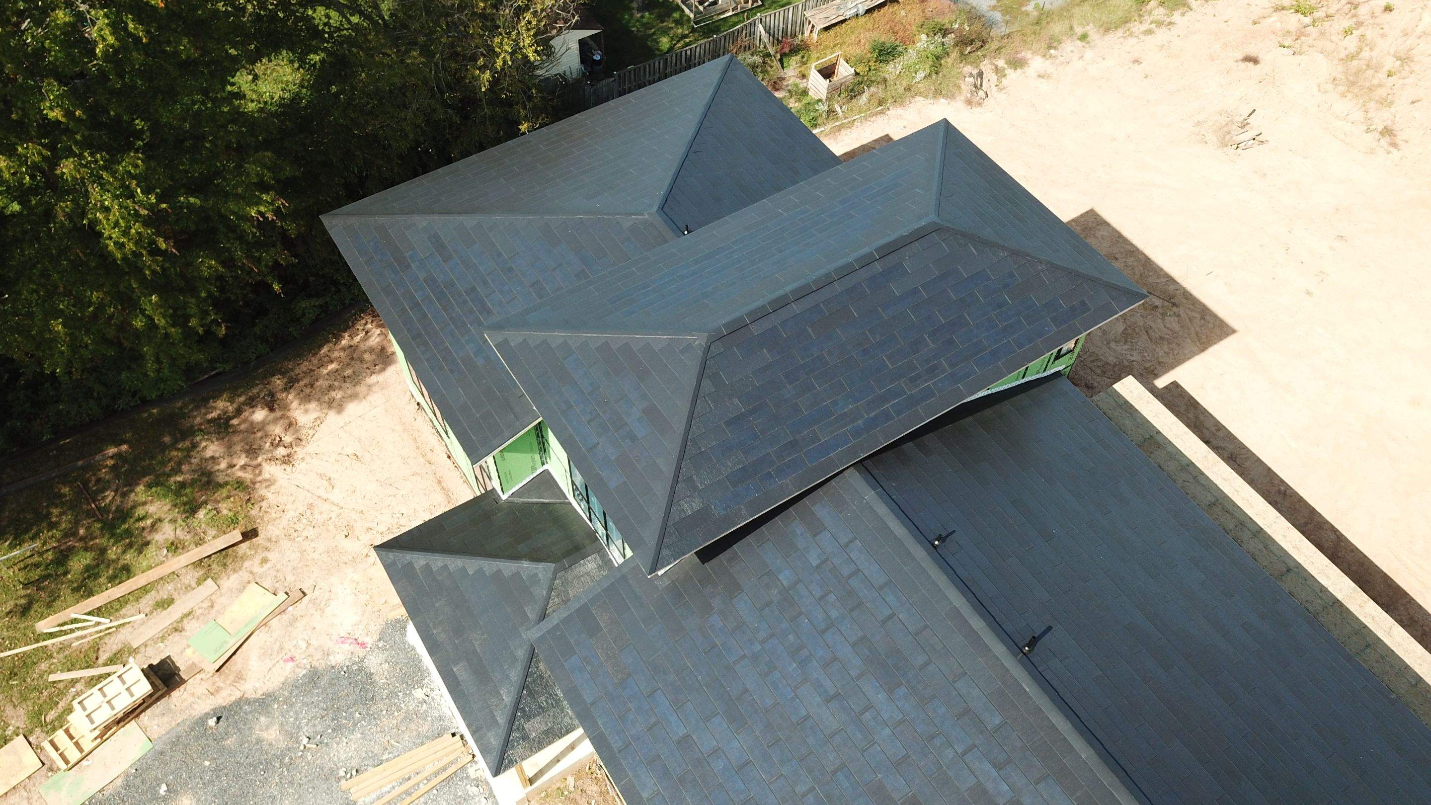 Tesla Solar Roof  using Tesla Solar Roof V3 tiles by American Home Contractors