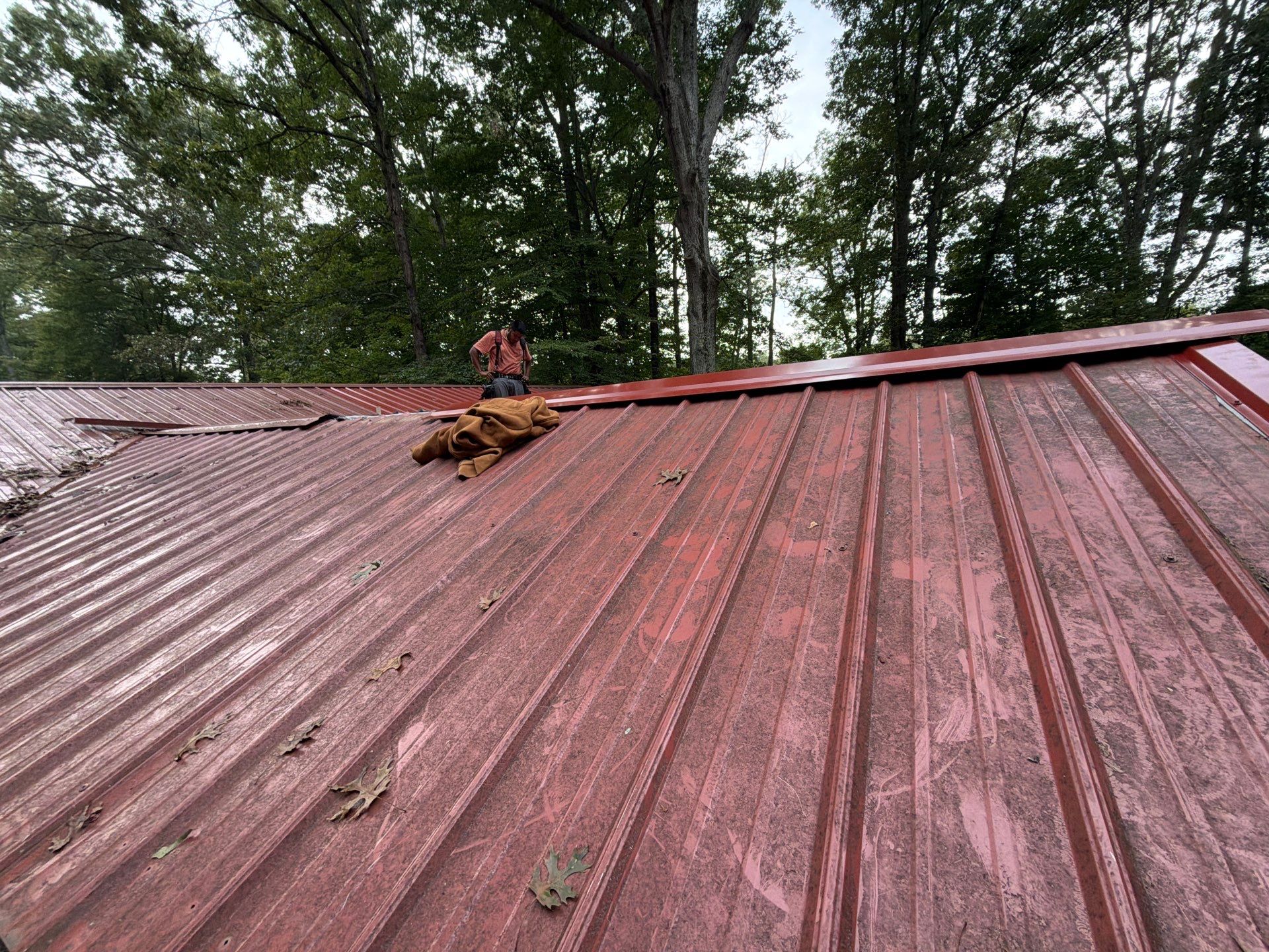 Red Metal Roof Restoration and Wood Fascia Replacement in Barboursville by Cade Construction